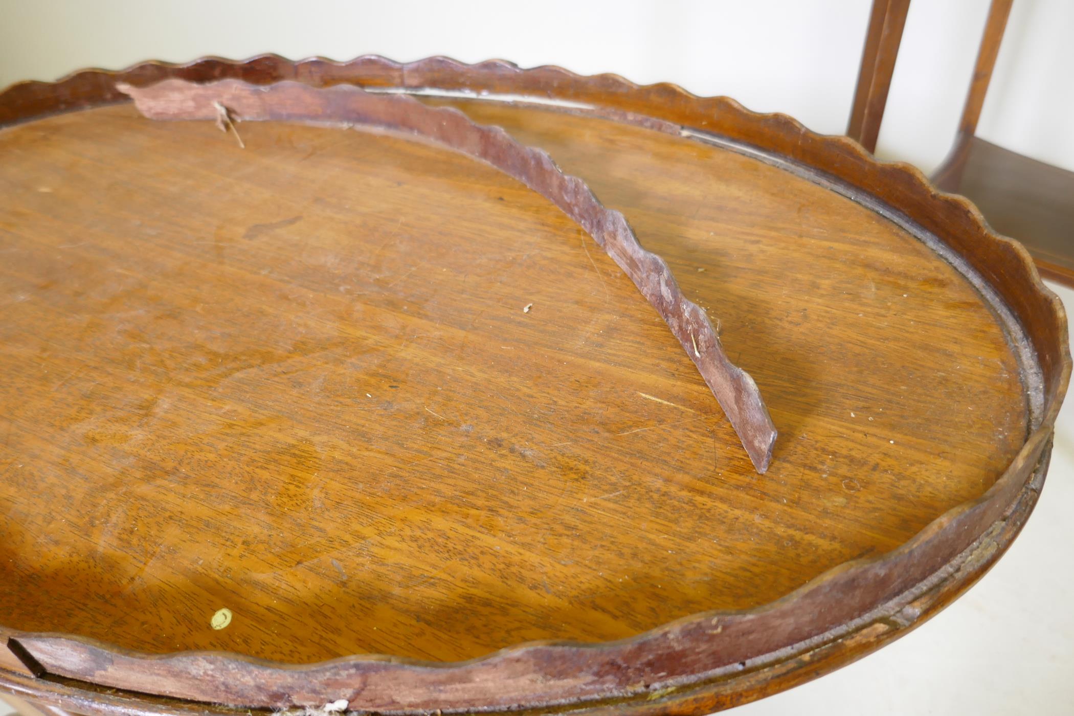 A Victorian mahogany two tier occasional table with oval top, raised on sabre supports, 70 x 43 x - Image 4 of 4