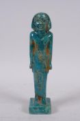 An Egyptian faience turquoise glaze shabti, 21cm high