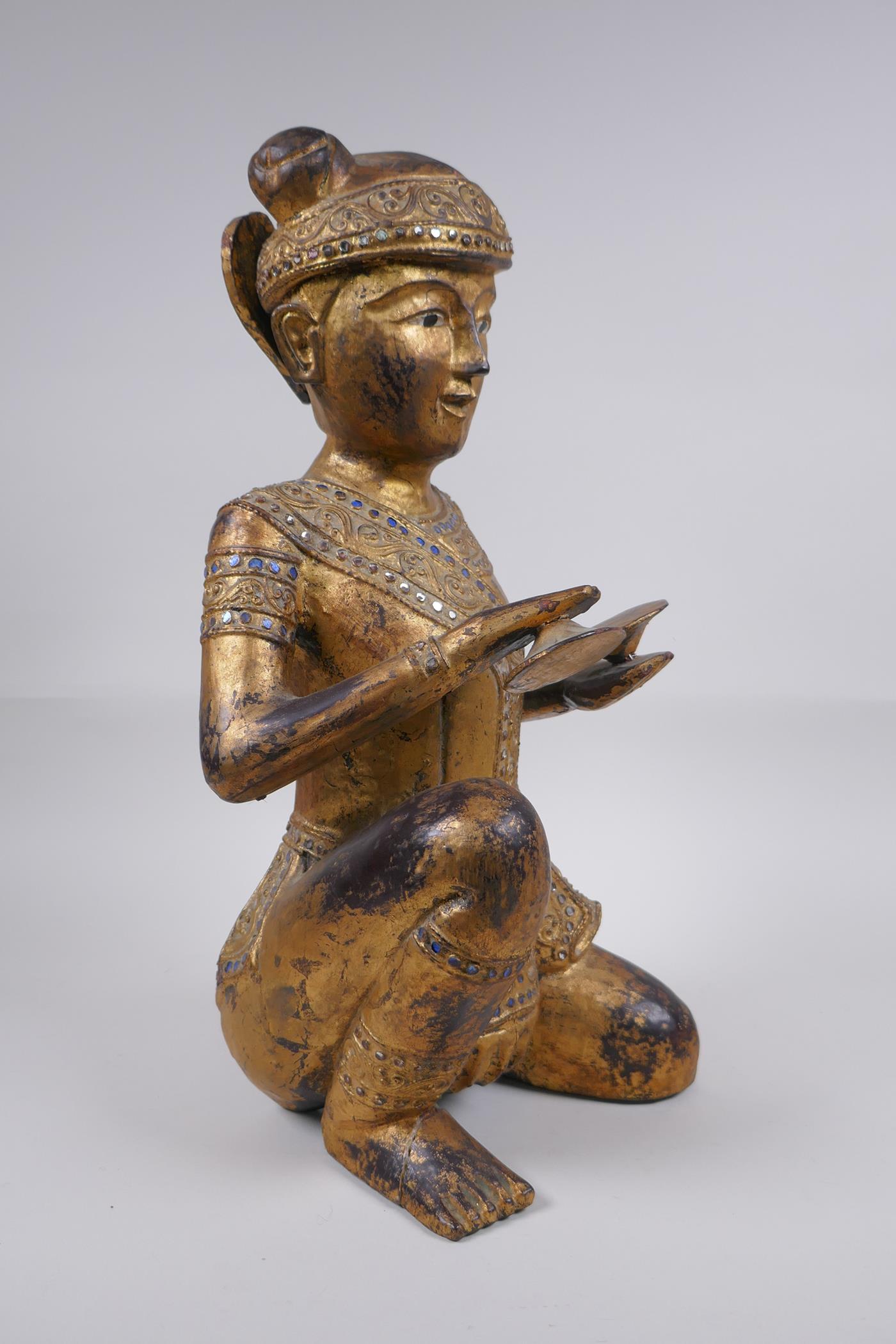 A Tibetan carved gilt and painted wood figure of a musician with inset glass decoration, 38cm - Image 2 of 6