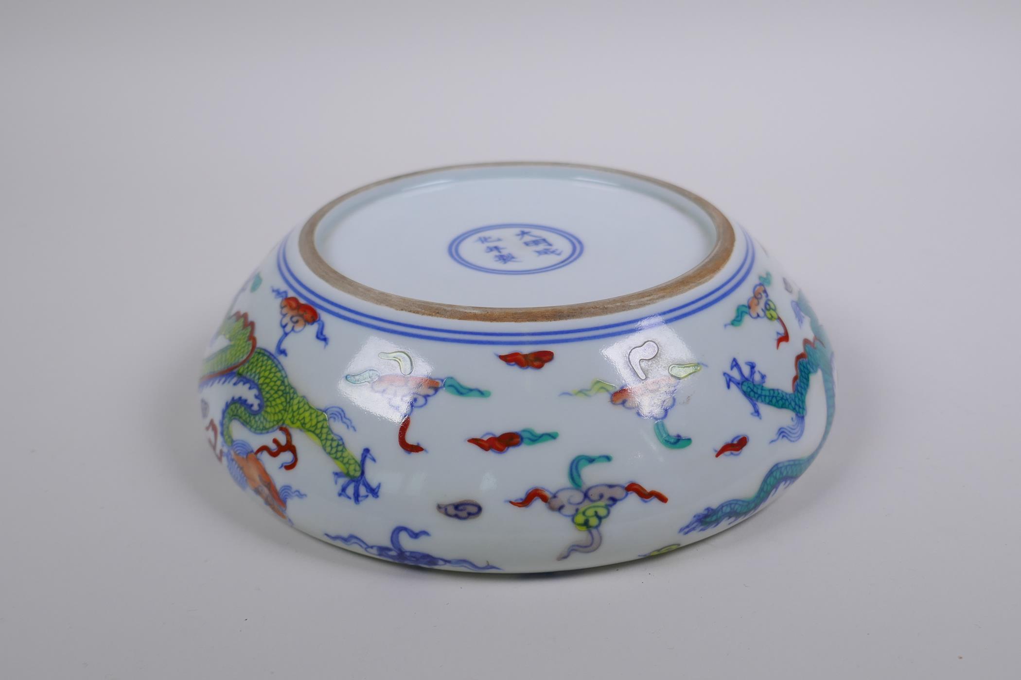 A Chinese Doucai porcelain dish with rolled rim, decorated with dragons, Chenghua 6 character mark - Image 6 of 7