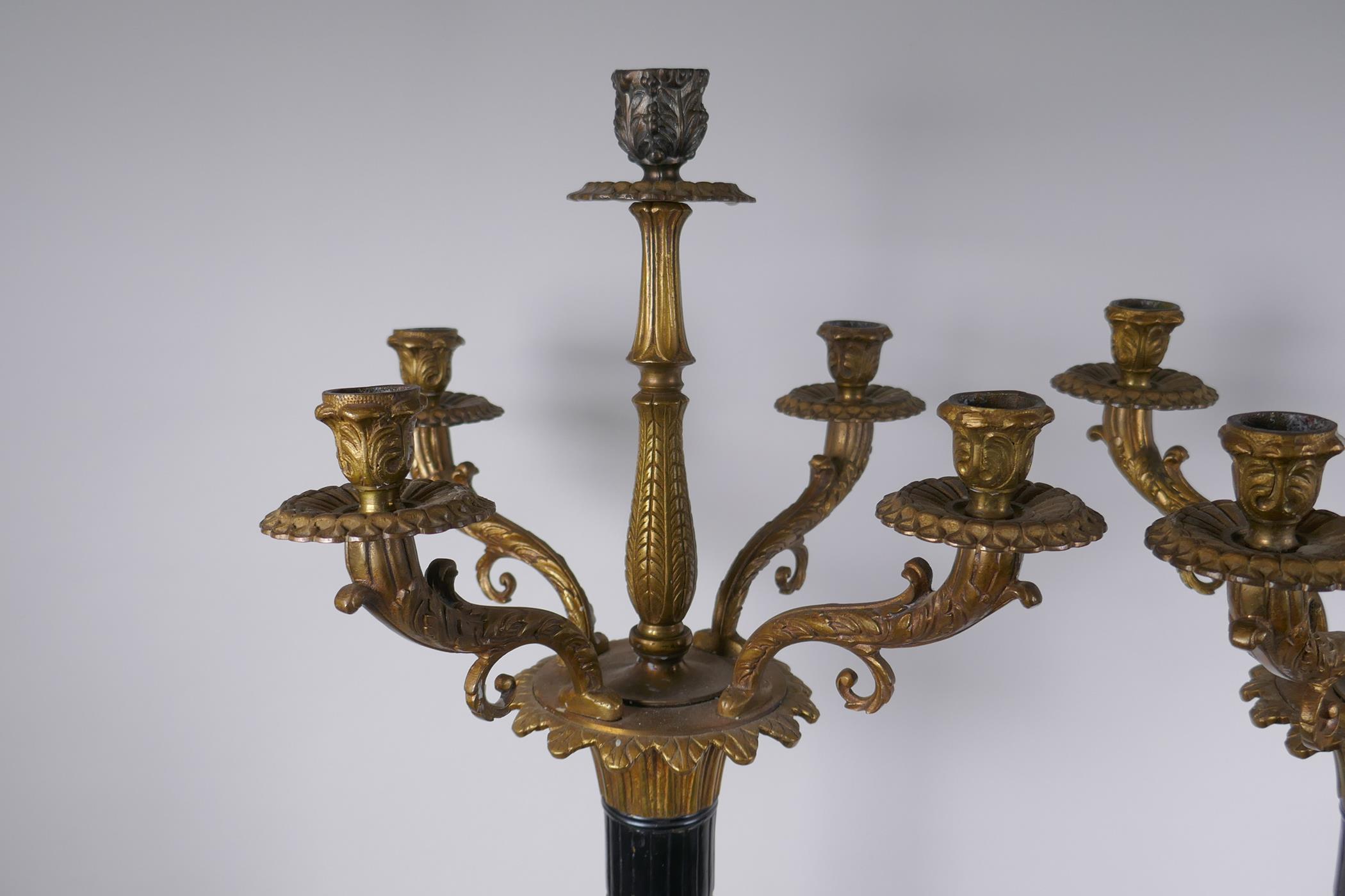 A pair of Empire style bronze and ormolu Corinthian column four branch candelabra, 80cm high - Image 3 of 7