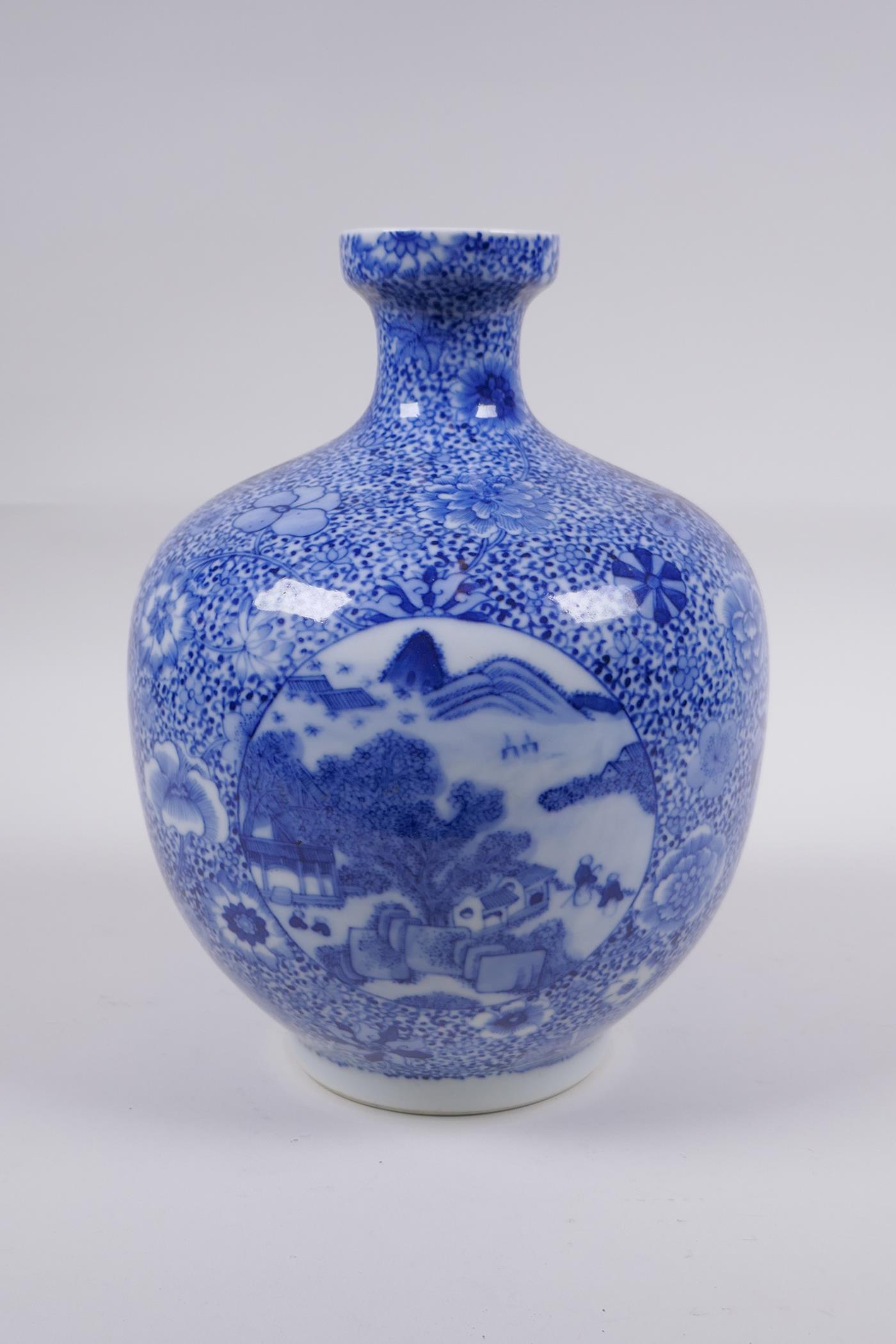 A blue and white porcelain vase with decorative panels depicting landscape scenes, in decorative - Image 3 of 6