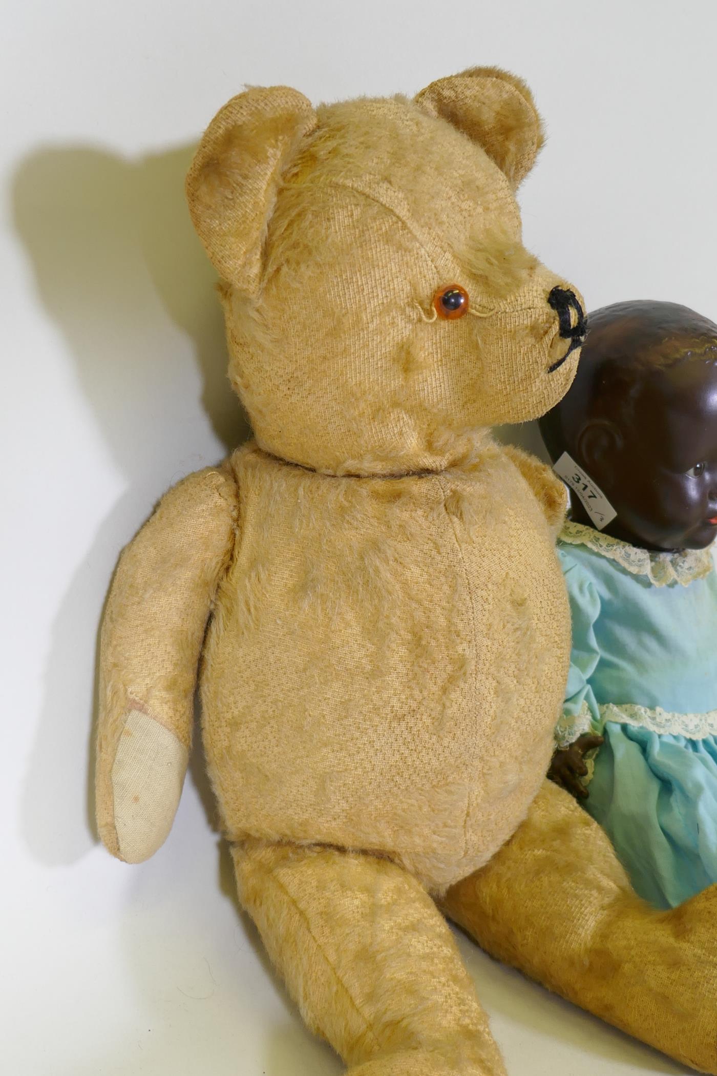 A vintage hump back teddy bear, 47cm long, an early C20th Hugo Wiegand black baby doll with - Image 4 of 5