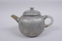 A Chinese painted YiXing teapot with a grey hardstone handle and spout, impressed seal mark to base,