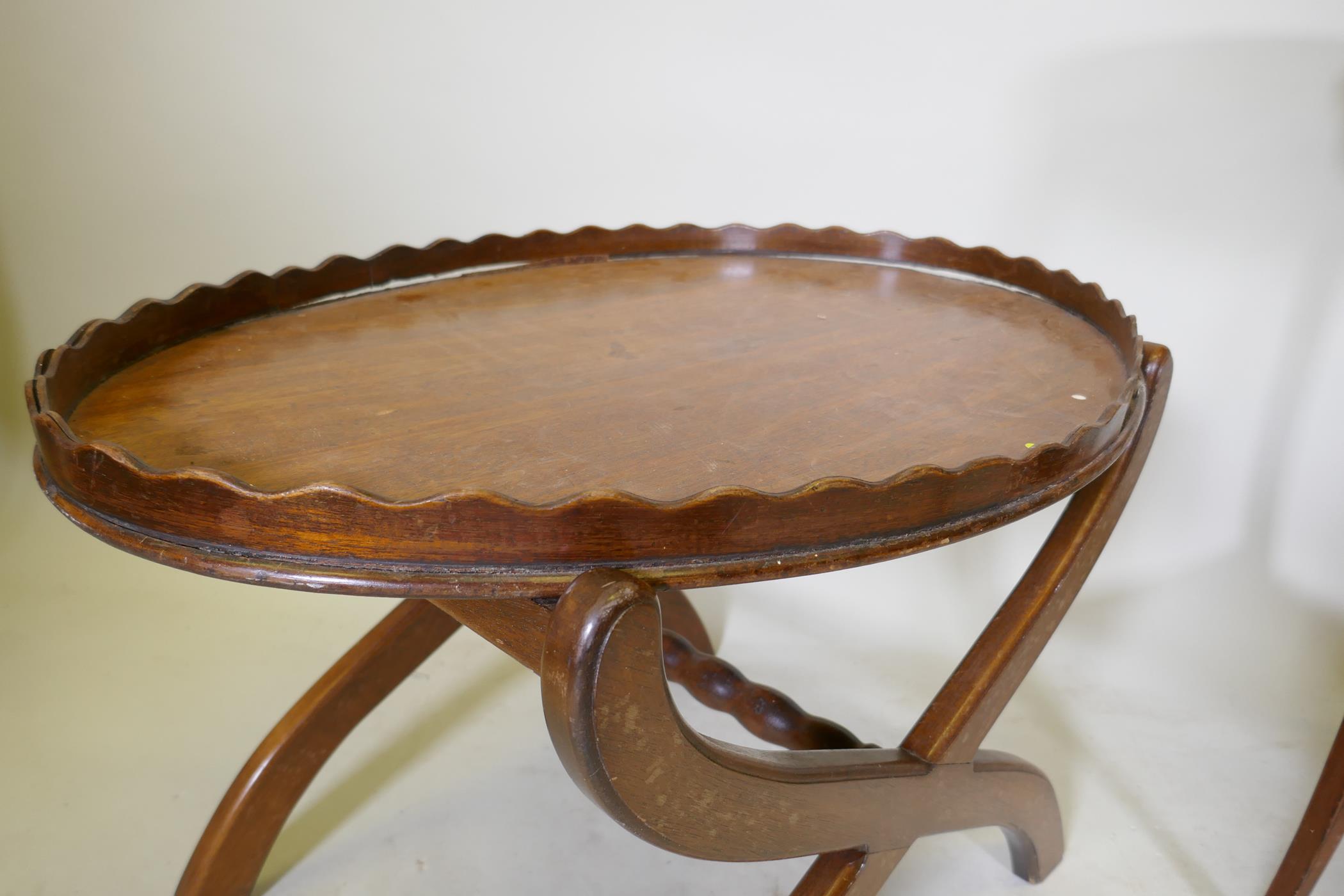 A Victorian mahogany two tier occasional table with oval top, raised on sabre supports, 70 x 43 x - Image 3 of 4