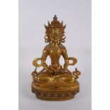 A Sino Tibetan gilt bronze Buddha seated holding a stupa, impressed double vajra mark to base,