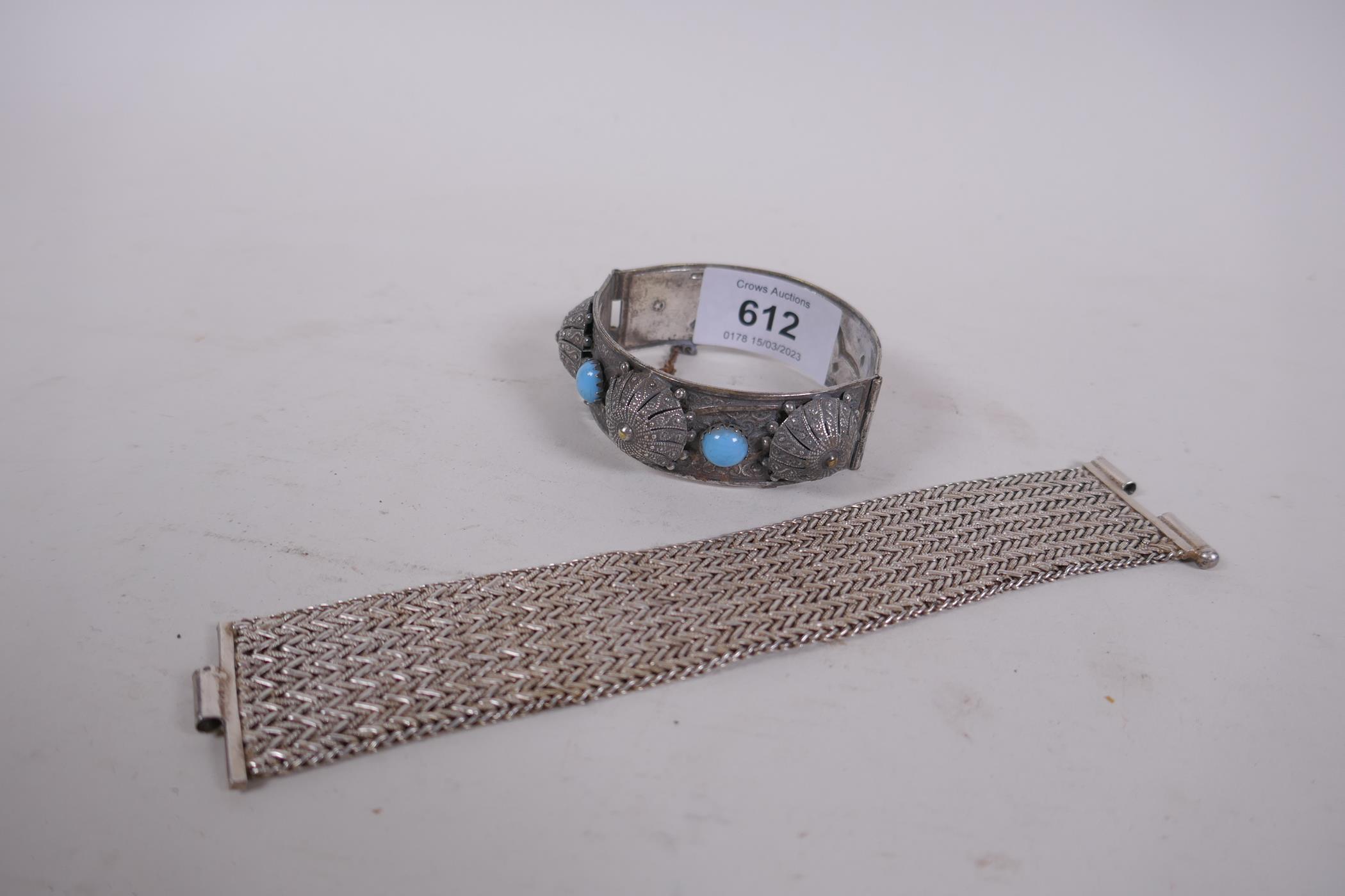 An Algerian silver bangle, inset with turquoise stones, 6cm diameter, and a similar white metal link