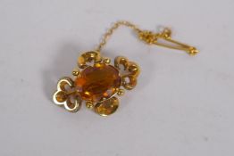 A Victorian yellow metal pendant brooch, set with a citrine, 3cm long, 3.8g