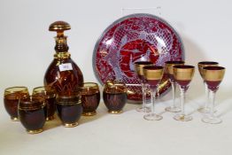 A Bohemian ruby glass decanter and six tumblers with etched and gilt decoration, a set of six wine