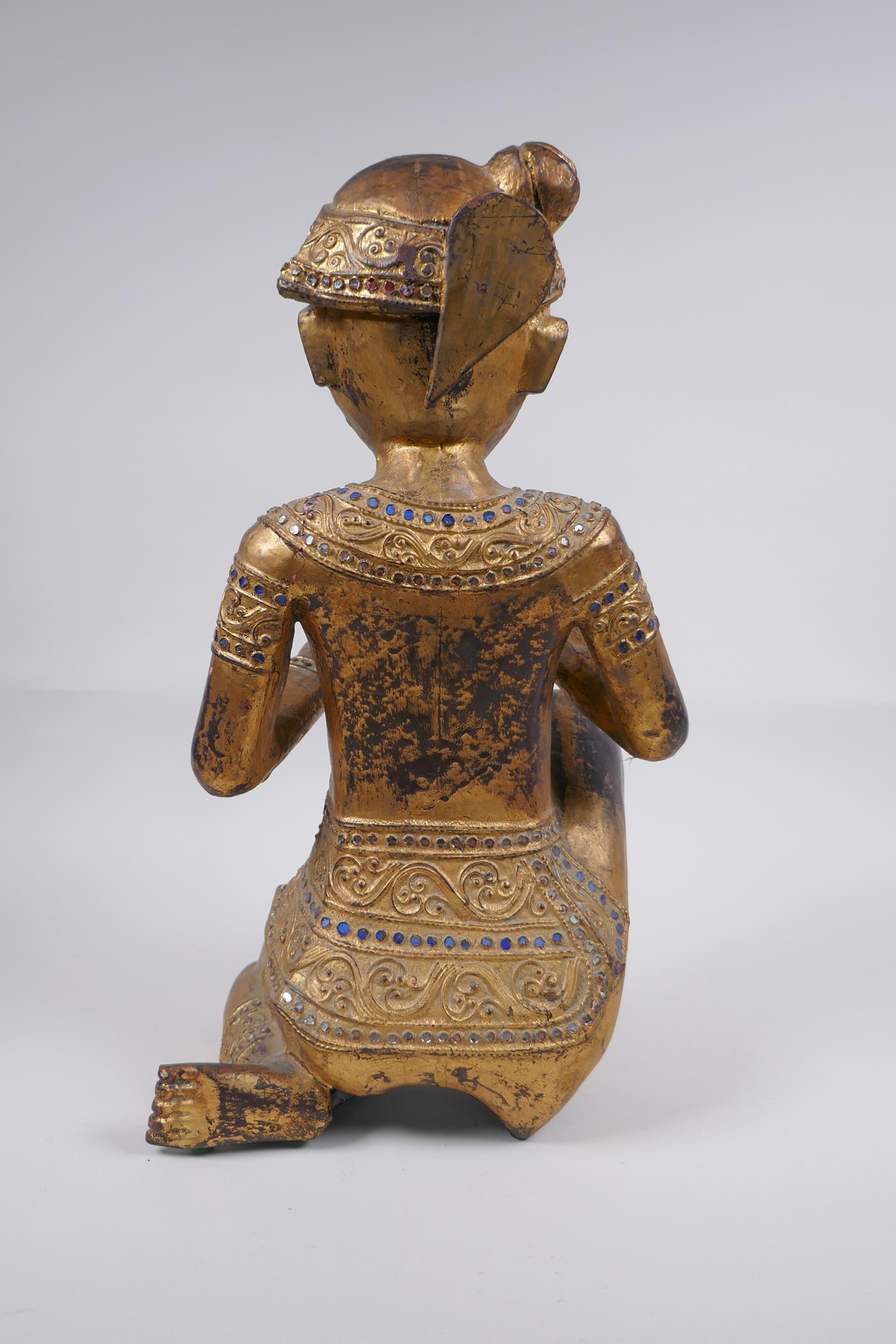 A Tibetan carved gilt and painted wood figure of a musician with inset glass decoration, 38cm - Image 6 of 6