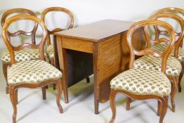 A C19th mahogany drop leaf dining table with satinwood banding, and a set of six Victorian