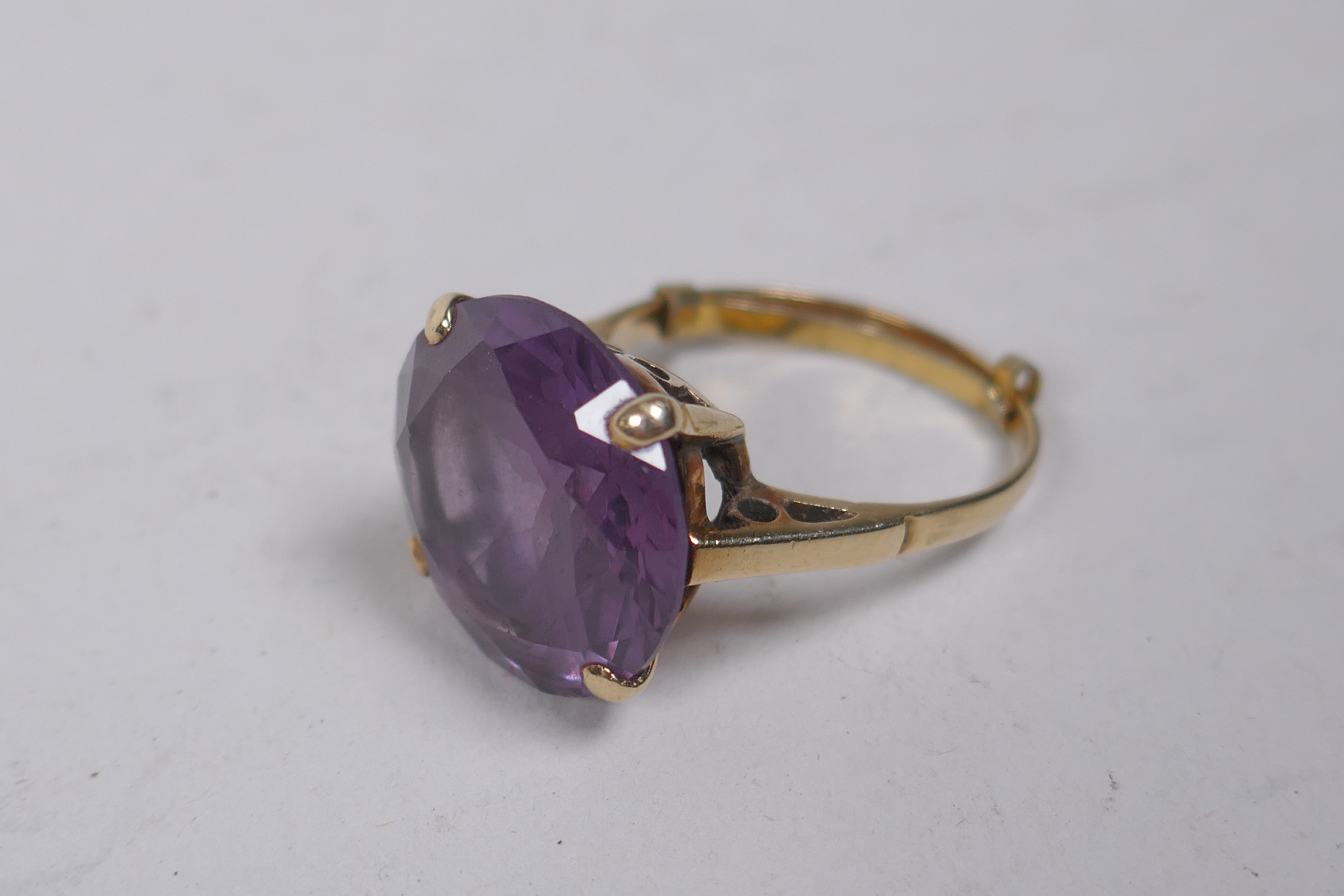 A vintage 9ct gold dress ring set with a large amethyst, size Q, 6g gross