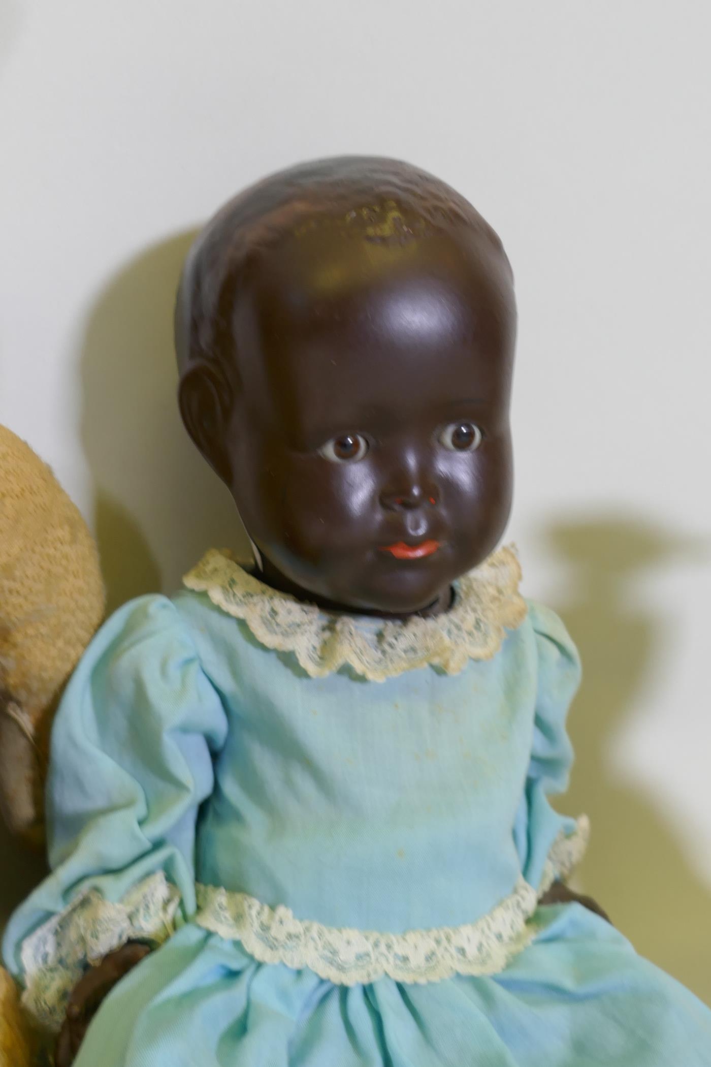 A vintage hump back teddy bear, 47cm long, an early C20th Hugo Wiegand black baby doll with - Image 5 of 5