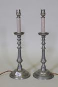 A pair of white metal candlestick table lamps, labelled Casagent Denmark, 43cm high