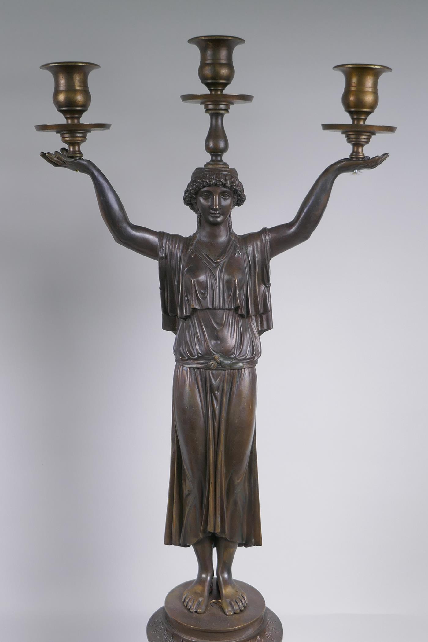 A pair of Empire style bronze three branch figural candlesticks in the form of classical women, 74cm - Image 4 of 7