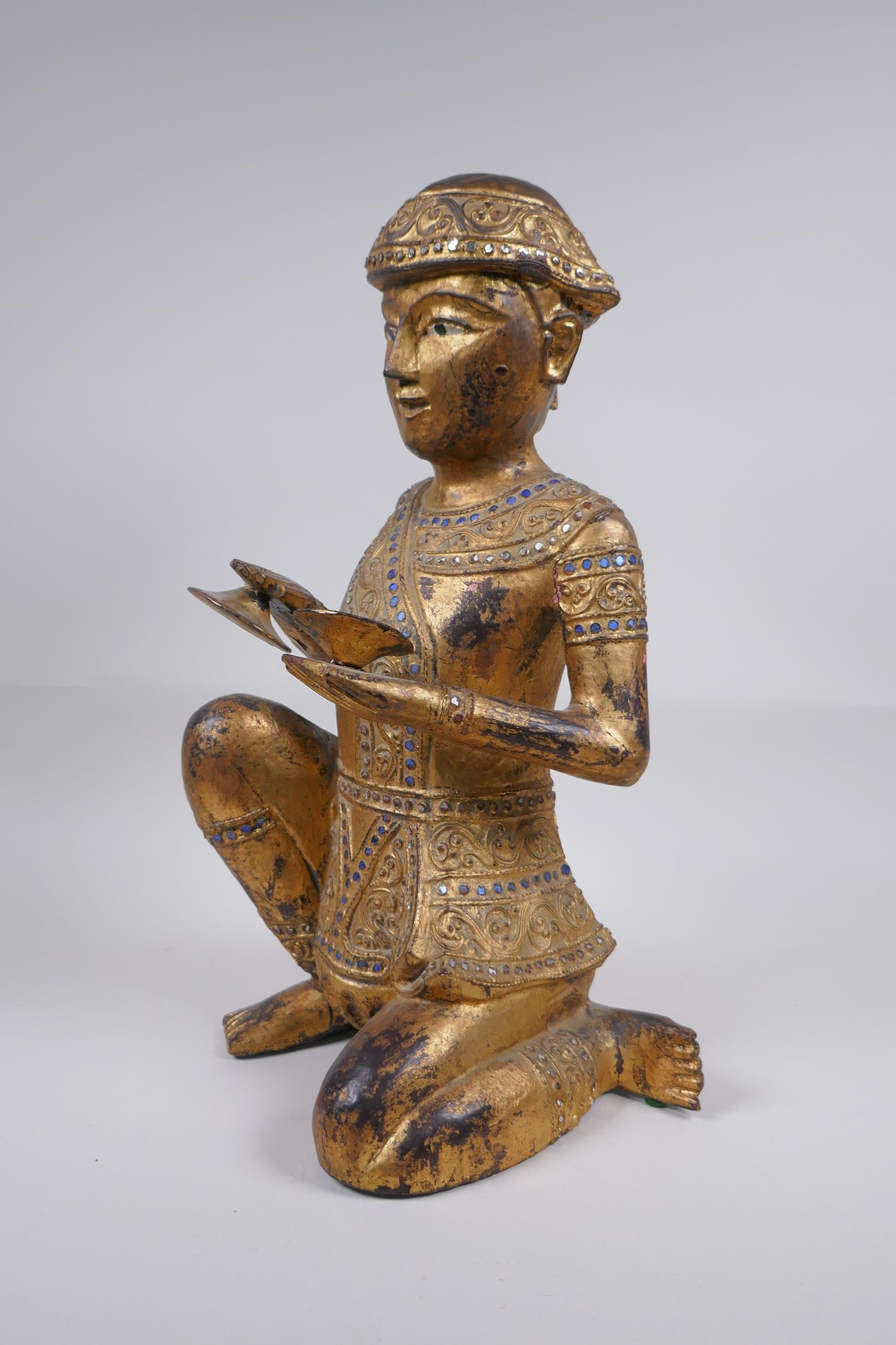 A Tibetan carved gilt and painted wood figure of a musician with inset glass decoration, 38cm - Image 3 of 6