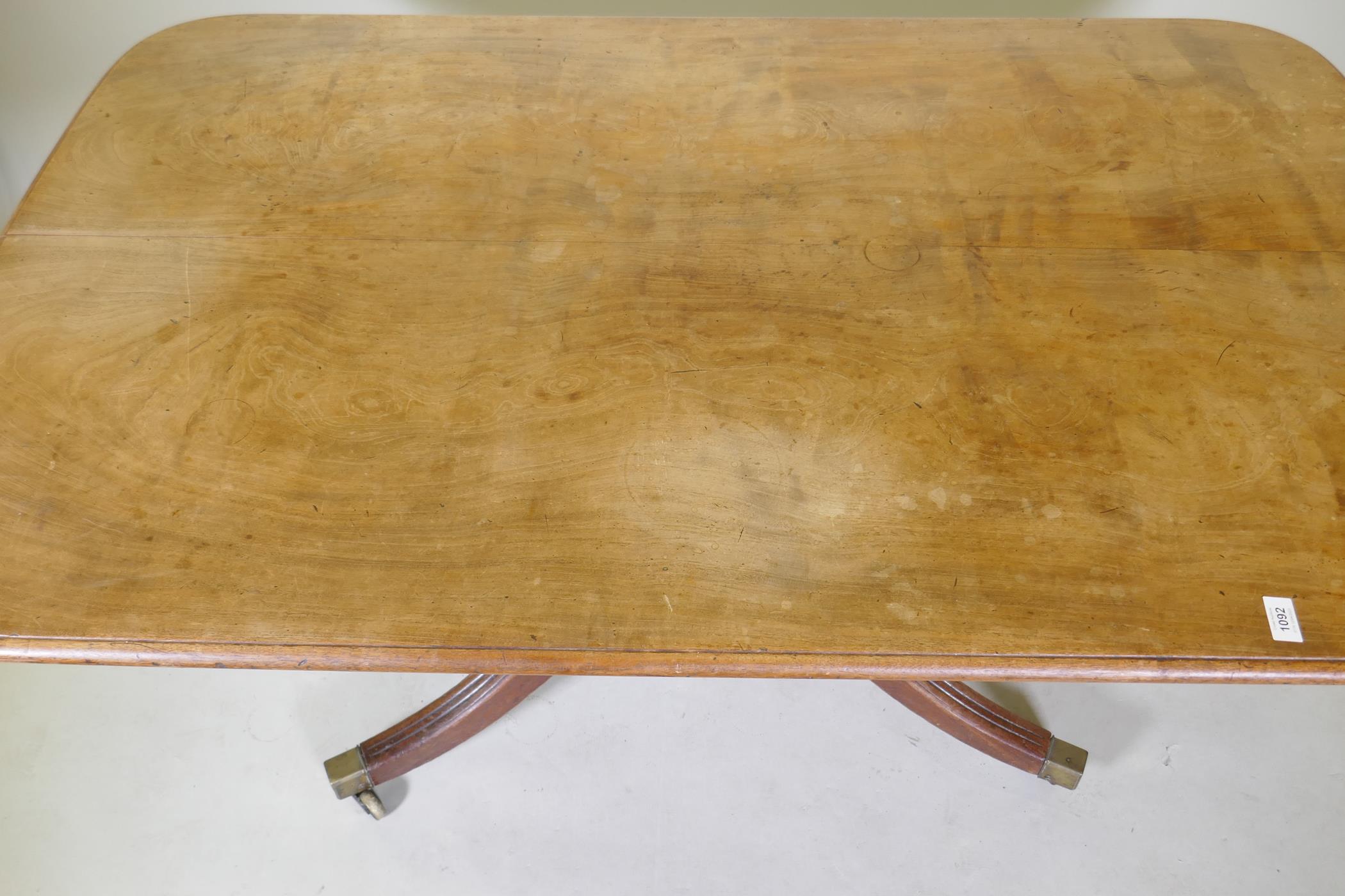 A mahogany breakfast table with an associated top, 95 x 148cm, 73cm high - Image 2 of 3