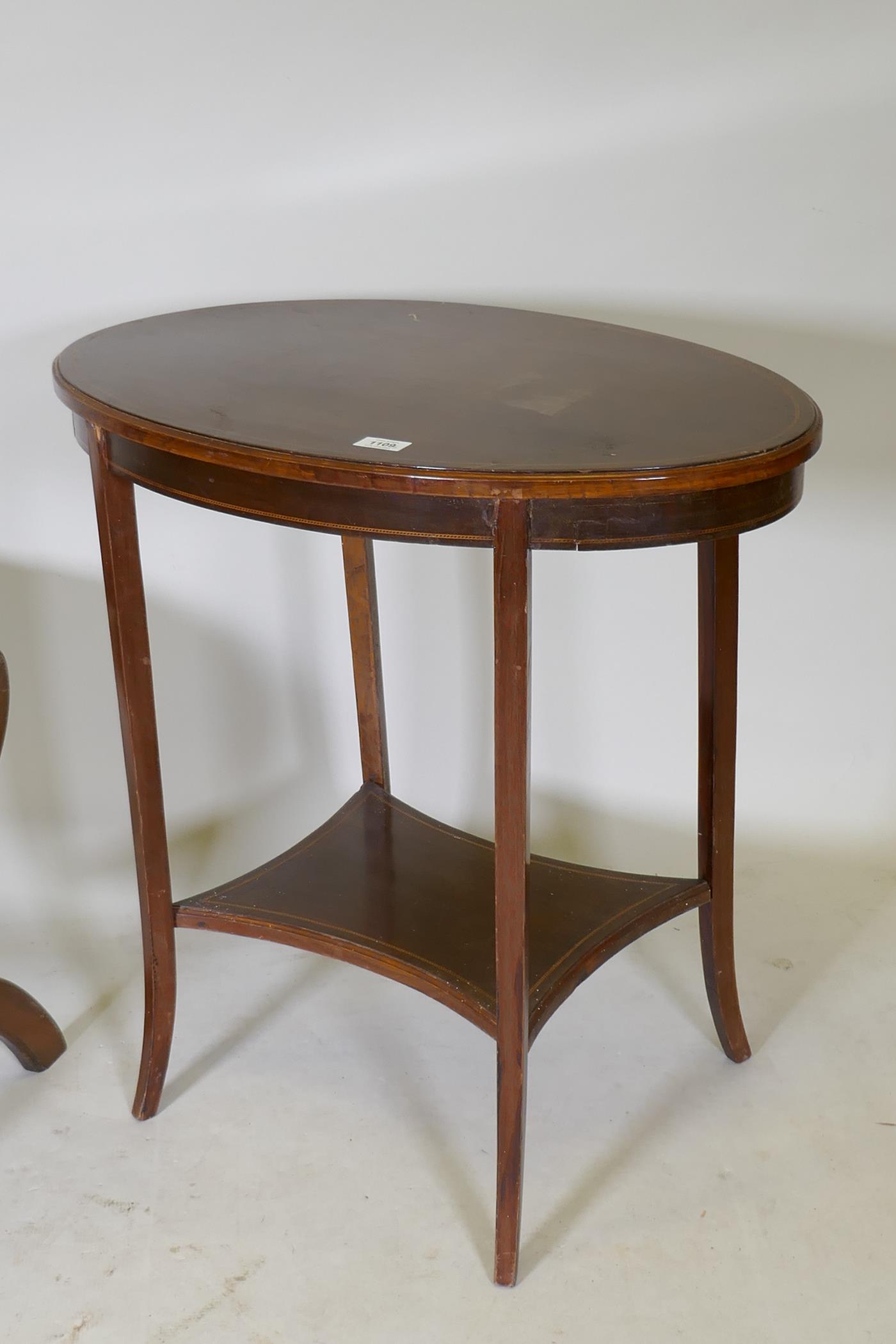 A Victorian mahogany two tier occasional table with oval top, raised on sabre supports, 70 x 43 x - Image 2 of 4