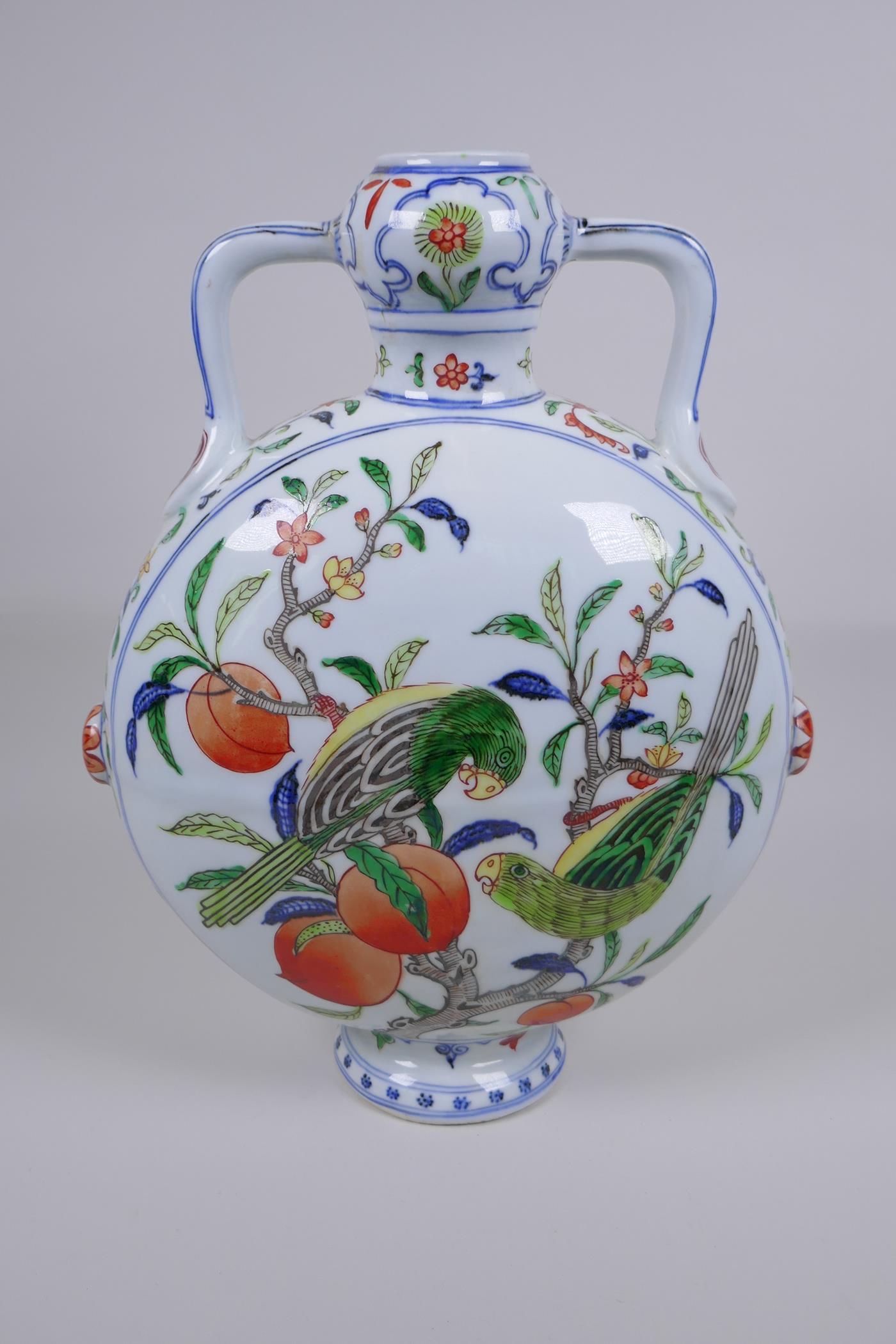 A Chinese polychrome porcelain two handled moon flask decorated with parrots in a peach tree, Xuande - Image 3 of 5