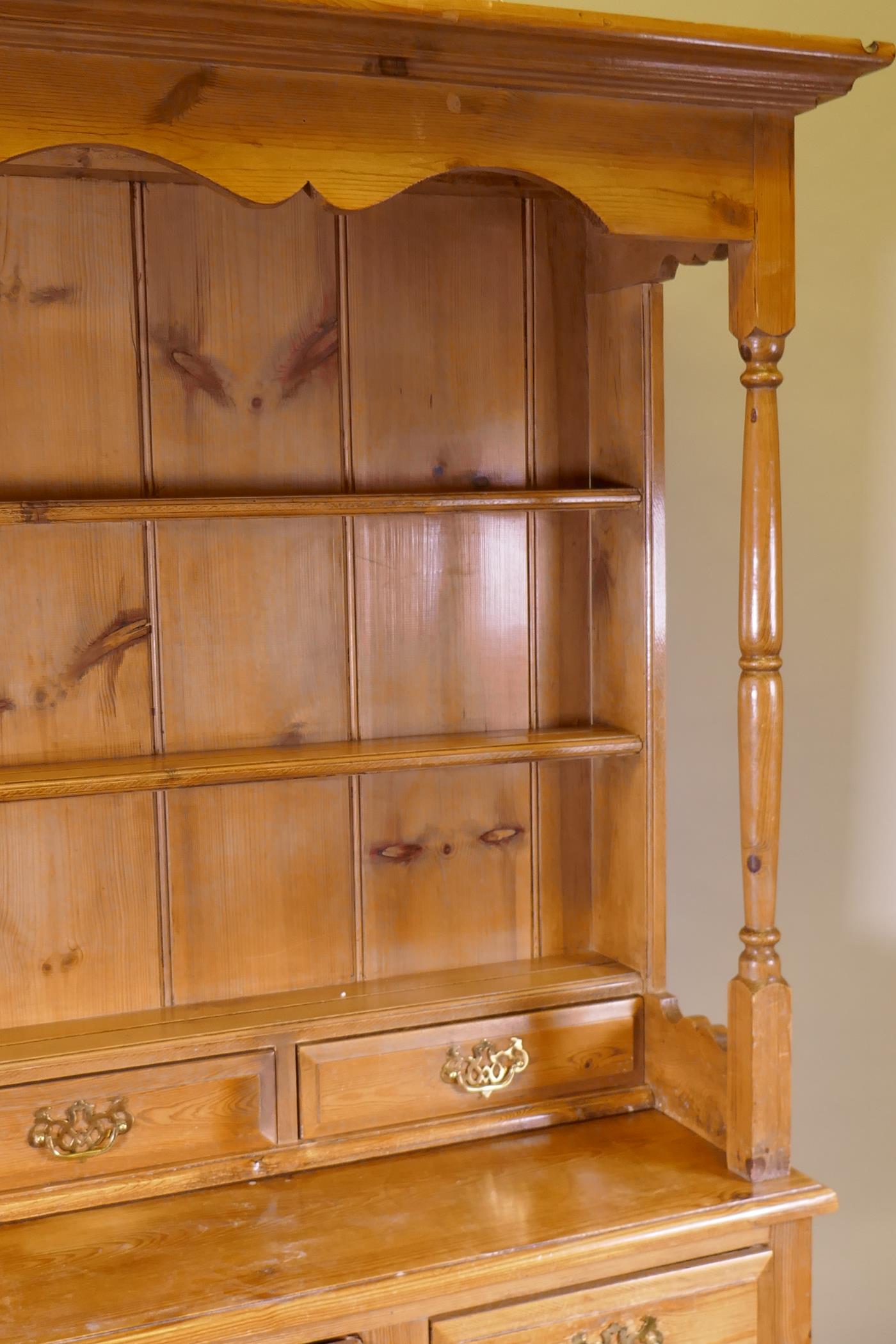 A pine dresser, the upper section with delft rack over four drawers, open sides, the base with - Image 4 of 5