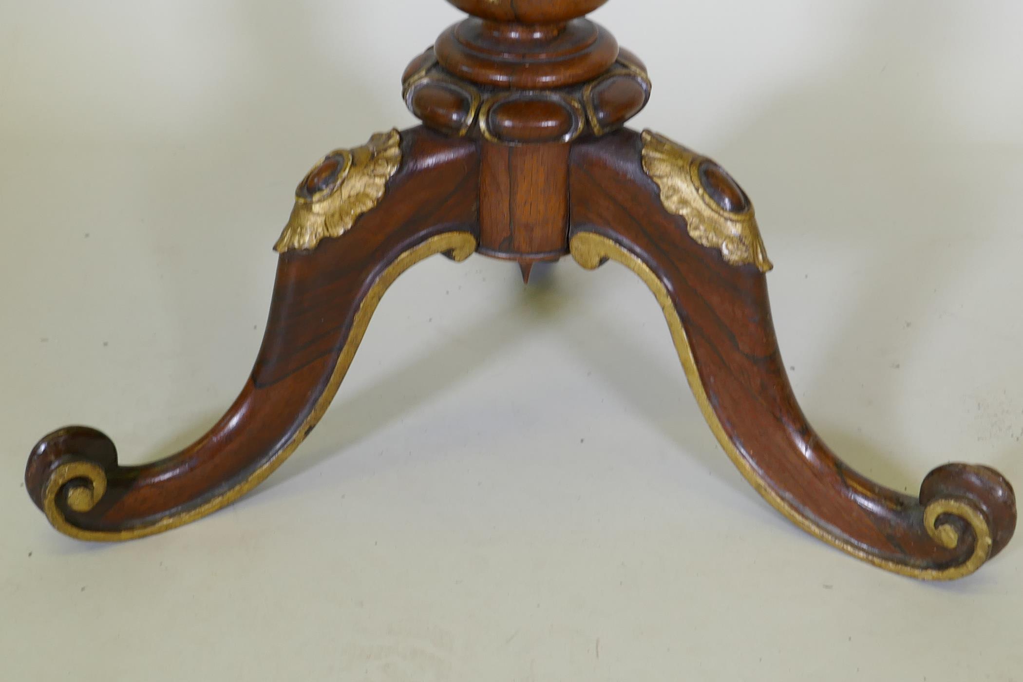 A Regency rosewood wine table, with parcel gilt decoration, raised on a carved and fluted column and - Image 3 of 5