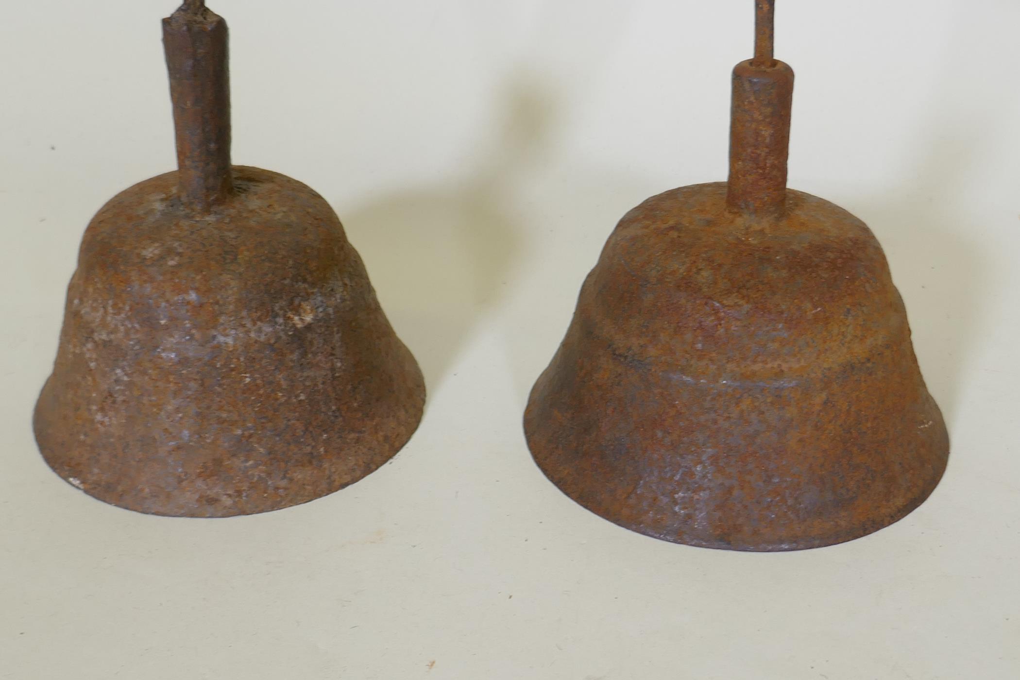 A pair of antique cast iron candlesticks, 42cm high - Image 2 of 2