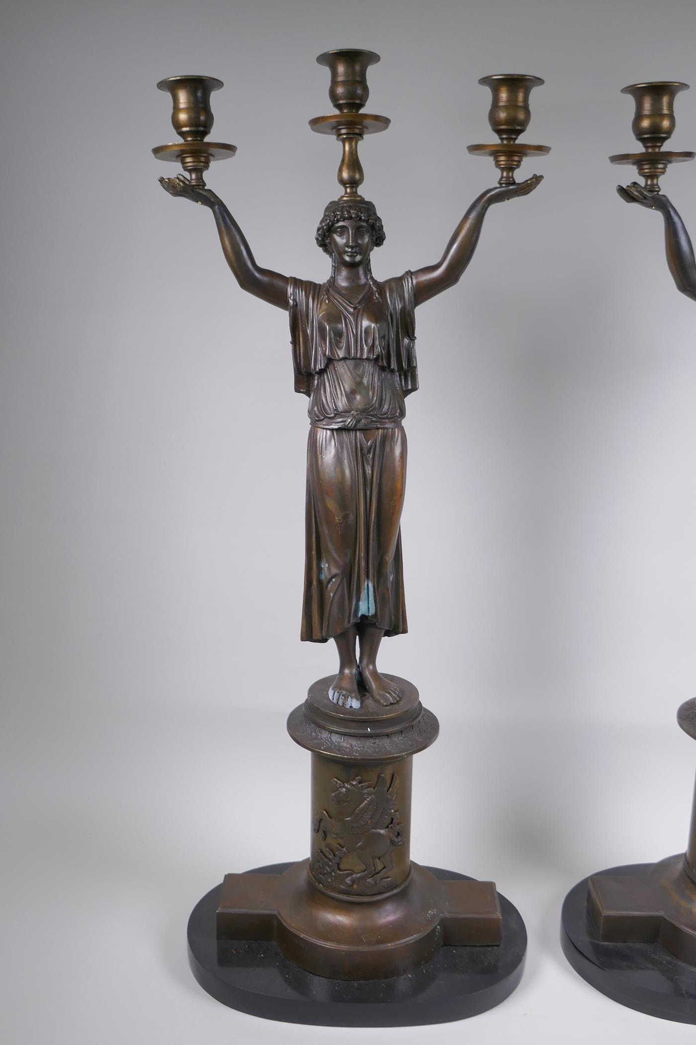 A pair of Empire style bronze three branch figural candlesticks in the form of classical women, 74cm - Image 2 of 7