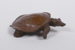 A Japanese style bronze okimono tortoise, seal mark to base, 9cm long