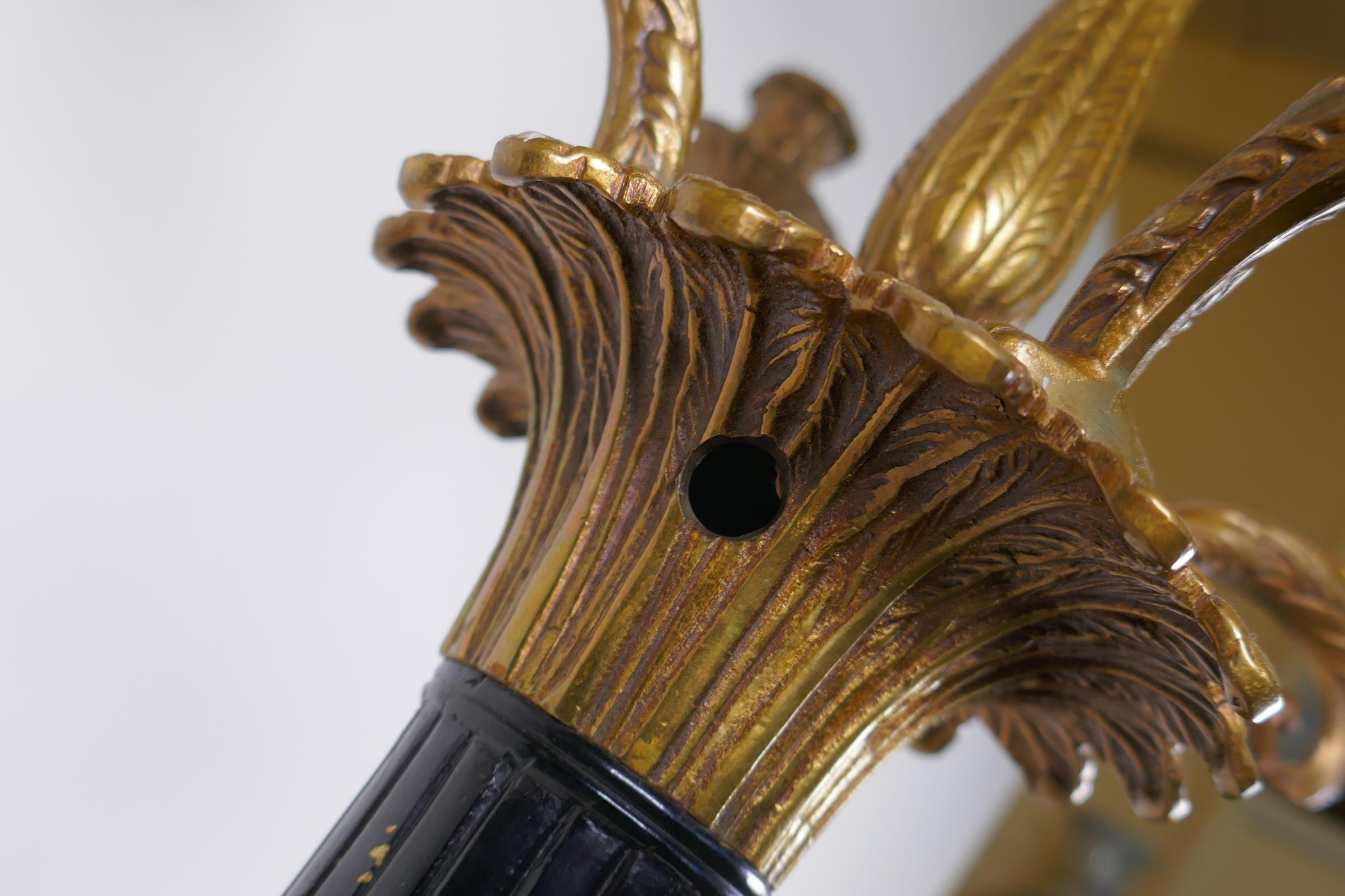 A pair of Empire style bronze and ormolu Corinthian column four branch candelabra, 80cm high - Image 7 of 7