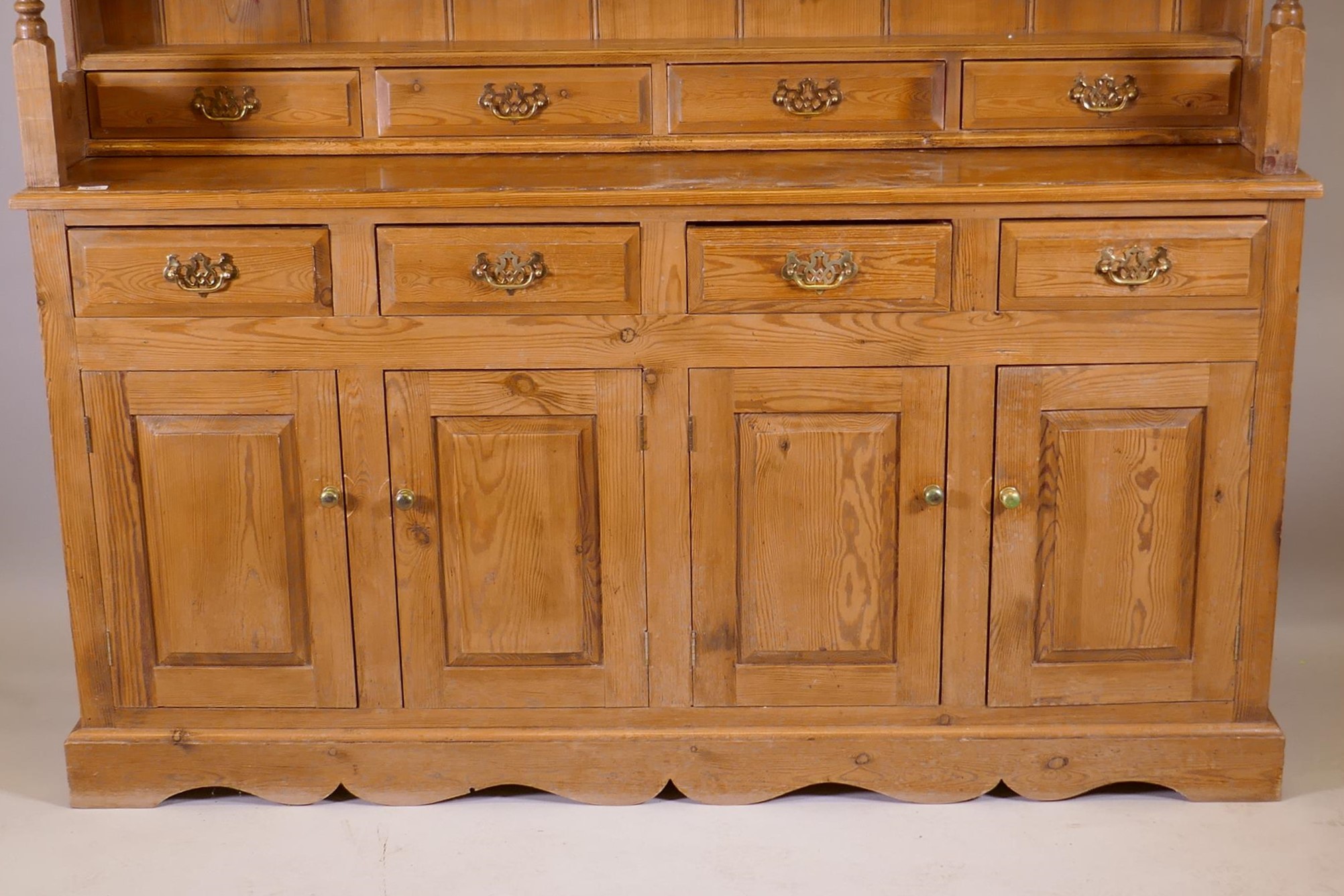 A pine dresser, the upper section with delft rack over four drawers, open sides, the base with - Image 2 of 5