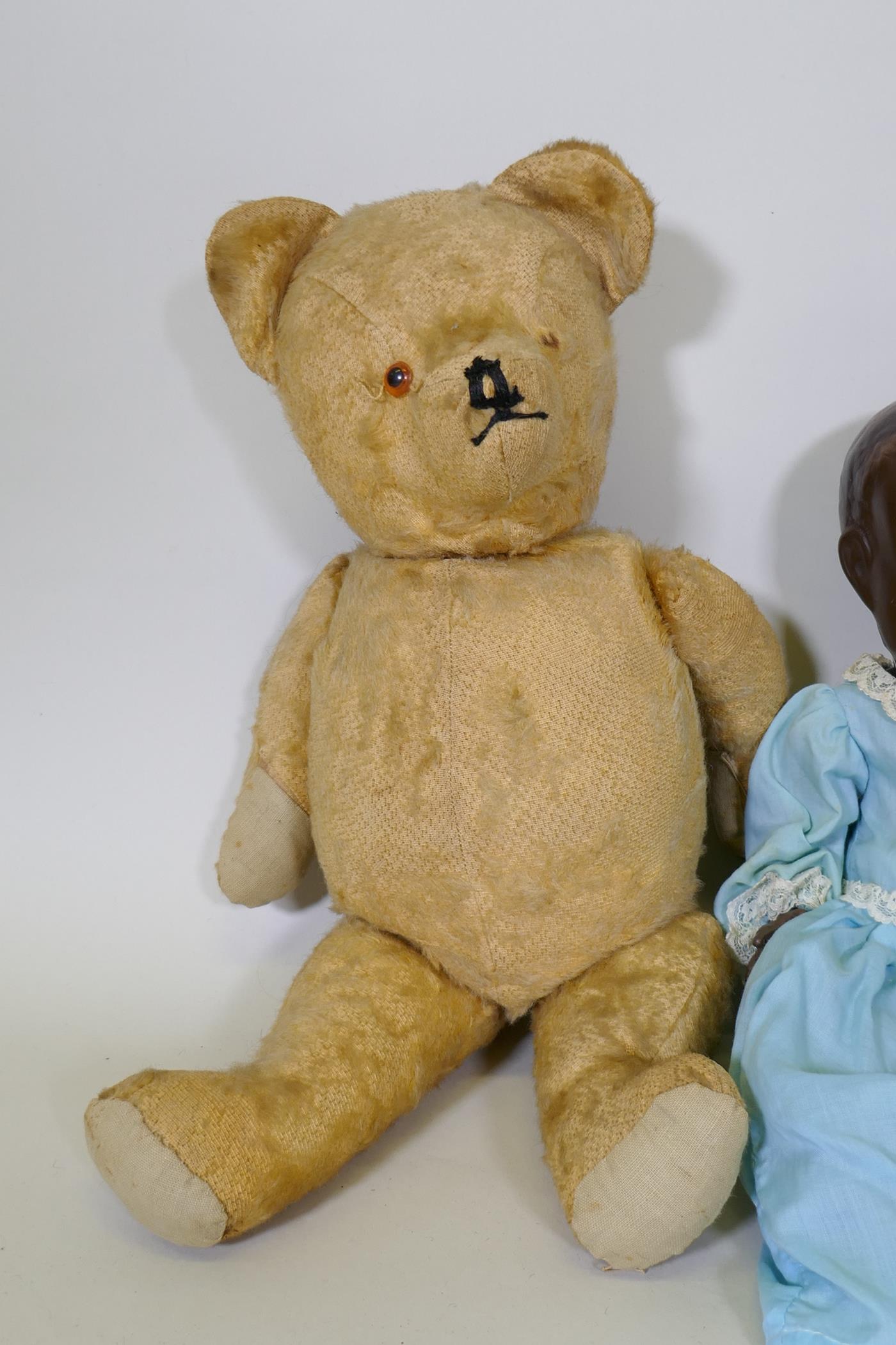 A vintage hump back teddy bear, 47cm long, an early C20th Hugo Wiegand black baby doll with - Image 3 of 5