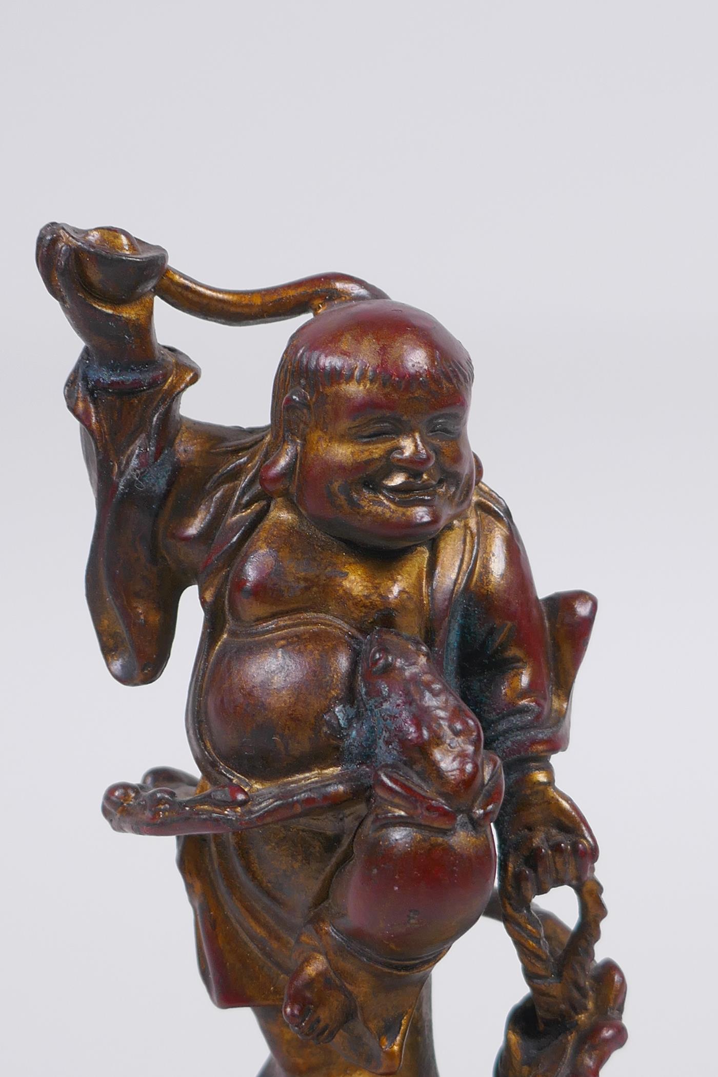 A Chinese gilt and coppered bronze figure of Lohan, 16cm high - Image 2 of 4