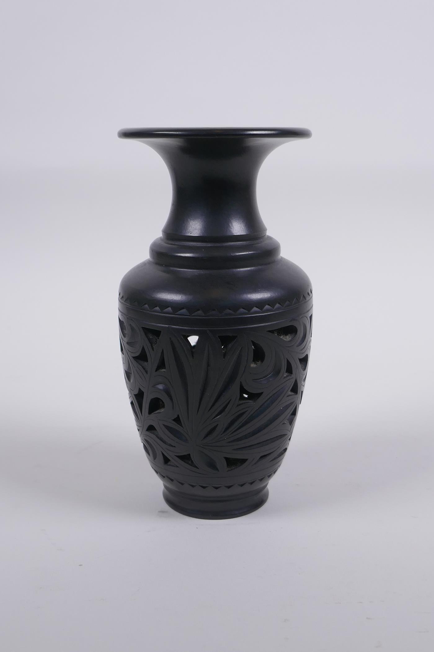 A Chinese black ground YiXing reticulated vase, impressed marks to base, 15cm high