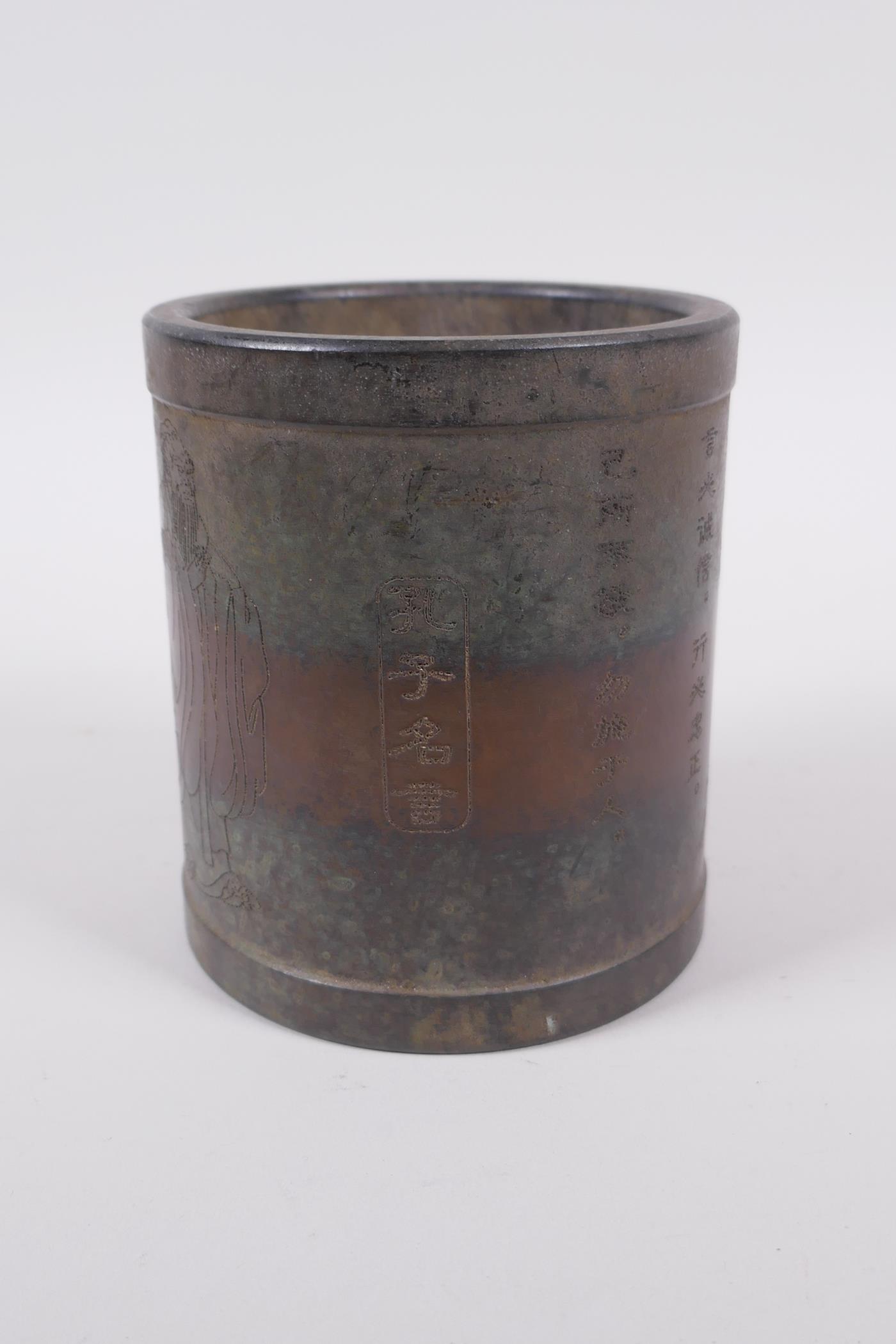 A Chinese bronze brush pot with Lohan and character decoration, impressed mark to base, 11cm high, - Image 2 of 5