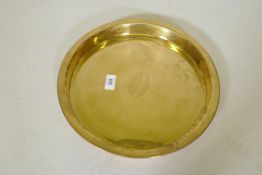 A brass tray engraved SS Nieuw-Amsterdam Holland-Amerika Lijn, 1st Class Only, 34cm diameter