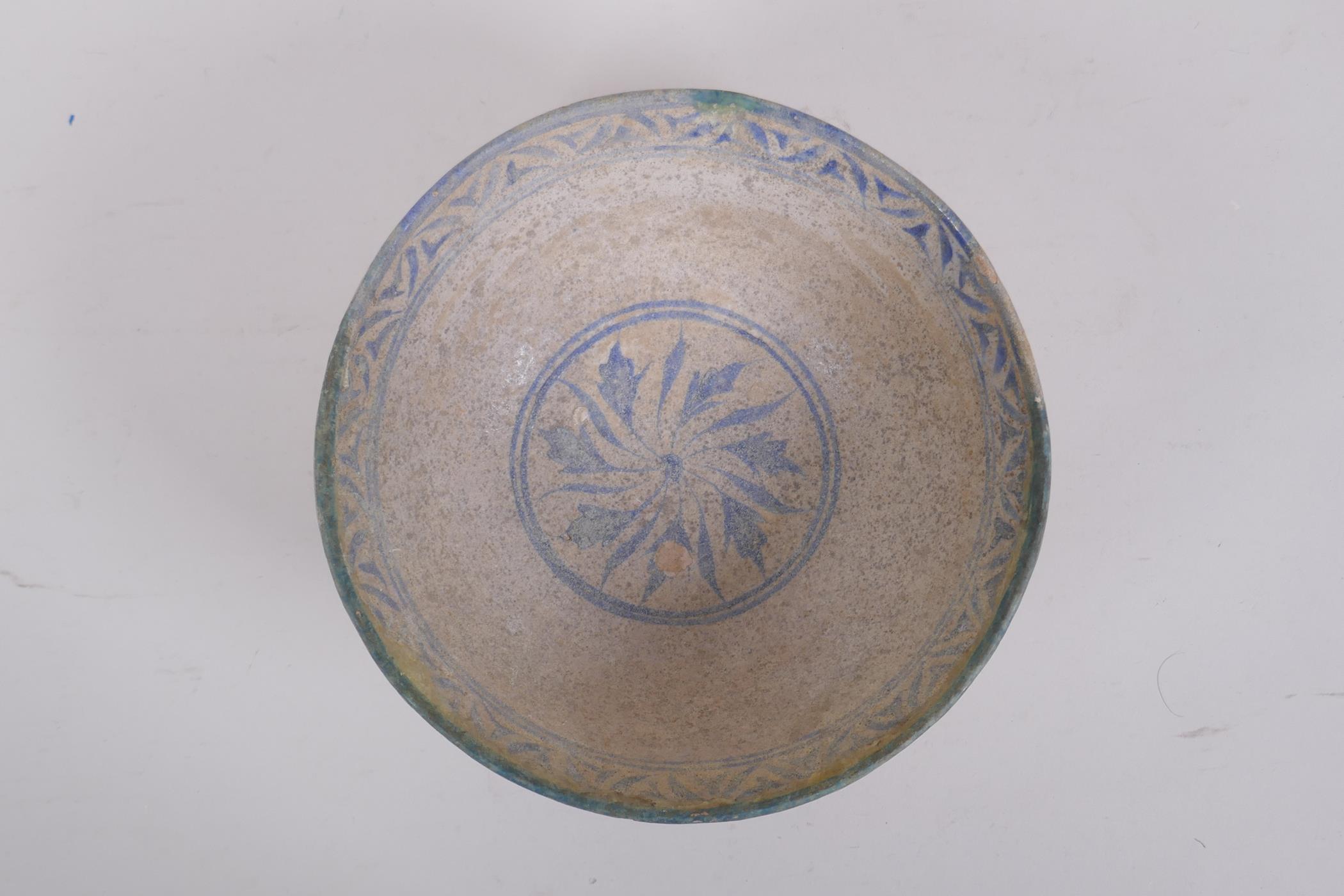 A middle eastern terracotta bowl with blue and white glazed decoration to the interior, 20cm - Image 2 of 5