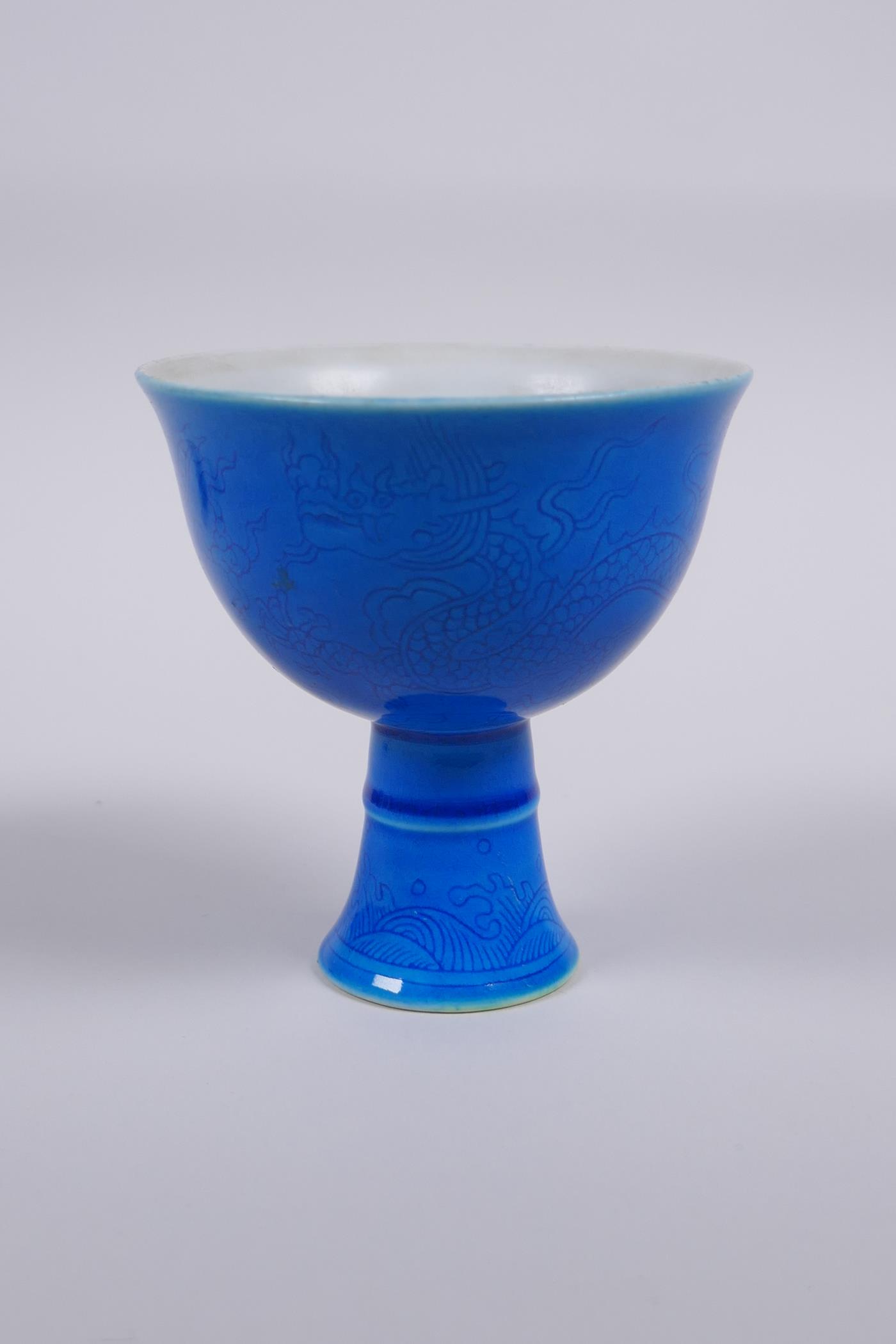 A blue glazed porcelain stem cup with incised dragon decoration, Chinese Chenghua 6 character mark
