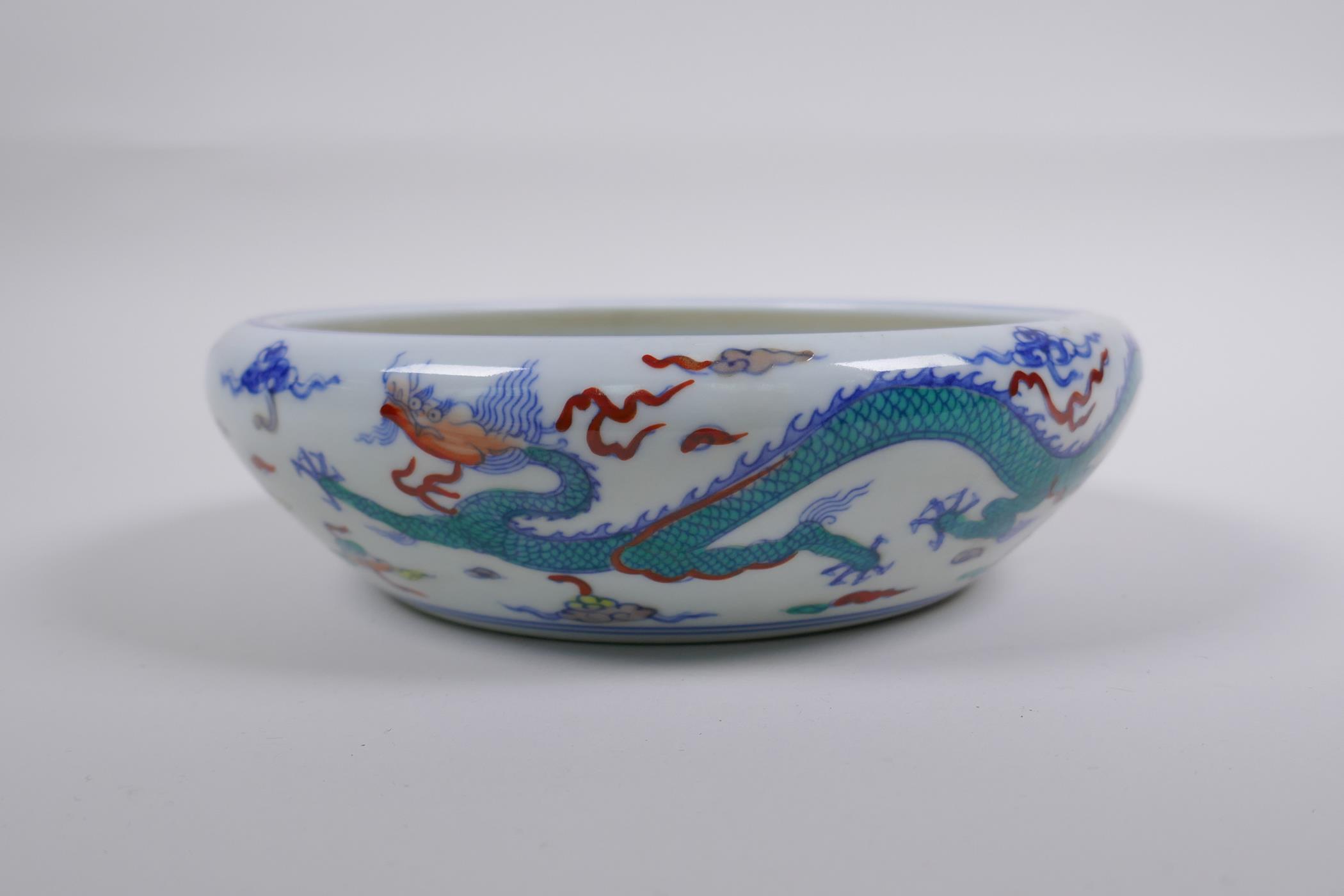 A Chinese Doucai porcelain dish with rolled rim, decorated with dragons, Chenghua 6 character mark - Image 4 of 7