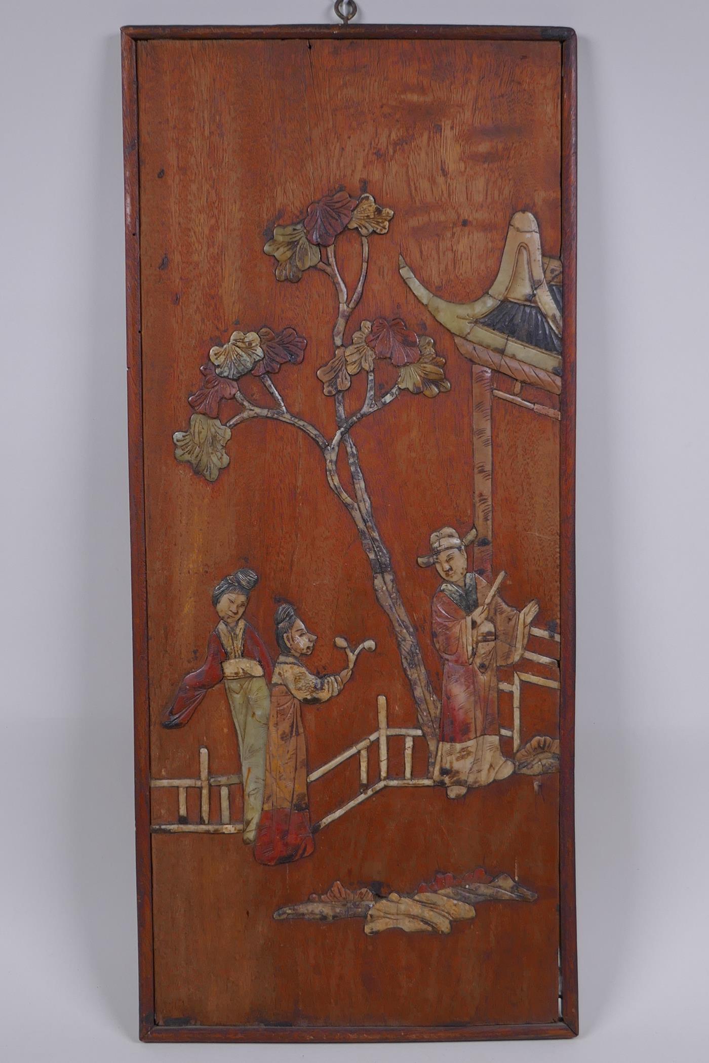 An antique Chinese hardwood panel with inlaid hardstone figural decoration, 20 x 46cm