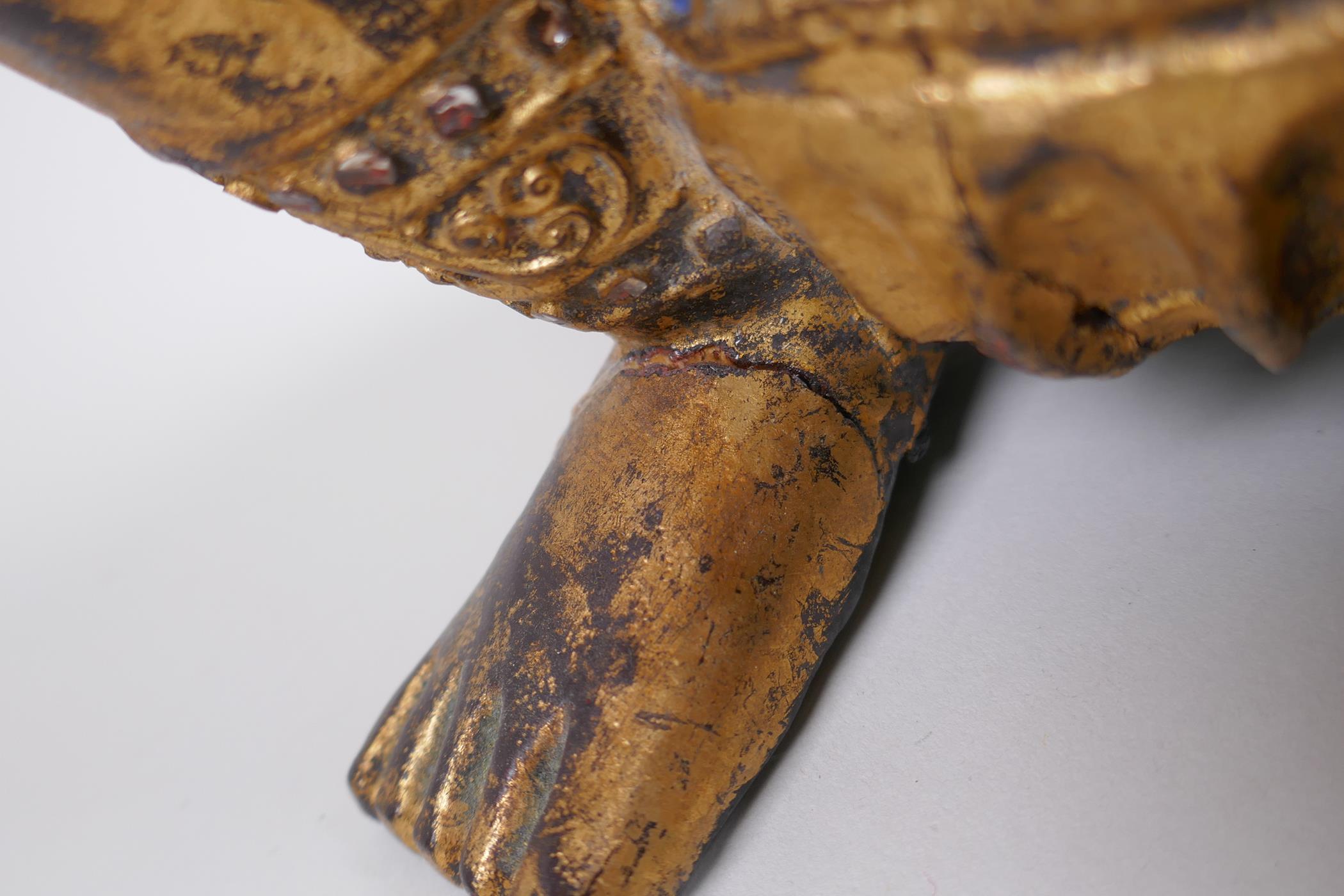 A Tibetan carved gilt and painted wood figure of a musician with inset glass decoration, 38cm - Image 5 of 6