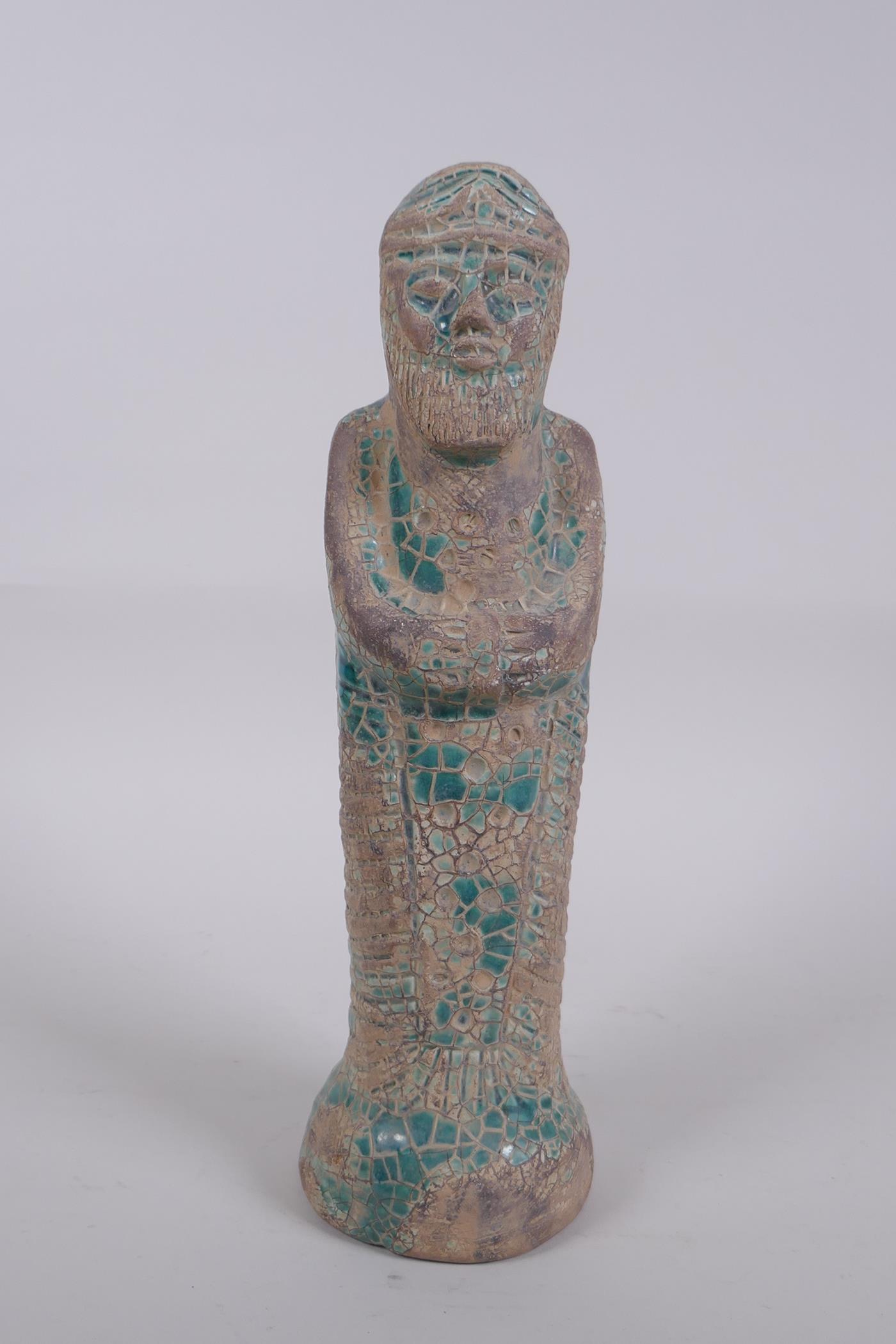 A turquoise crackle glazed terracotta figure of a bearded Persian gentleman, 9cm high