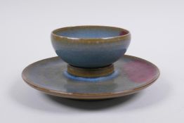 A Chinese Jun ware tea bowl and saucer, 14cm diameter