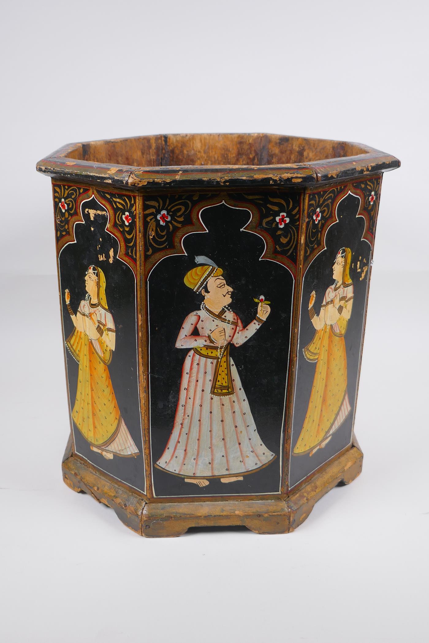 An Indian octagonal wood planter with hand painted figural decoration to each panel, 31cm high