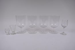 Four early C20th glass goblets etched with a rampant lion, and three other C19th glasses, largest