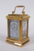 An ormolu and Sevres style porcelain carriage clock with day and date subsidiary dials, 8cm high