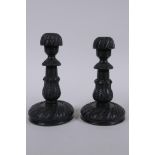 A pair of Anglo Indian carved ebony candlesticks, 14cm high