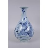 A Chinese blue and white porcelain pear shaped vase, decorated with a dragon in flight, 32cm high