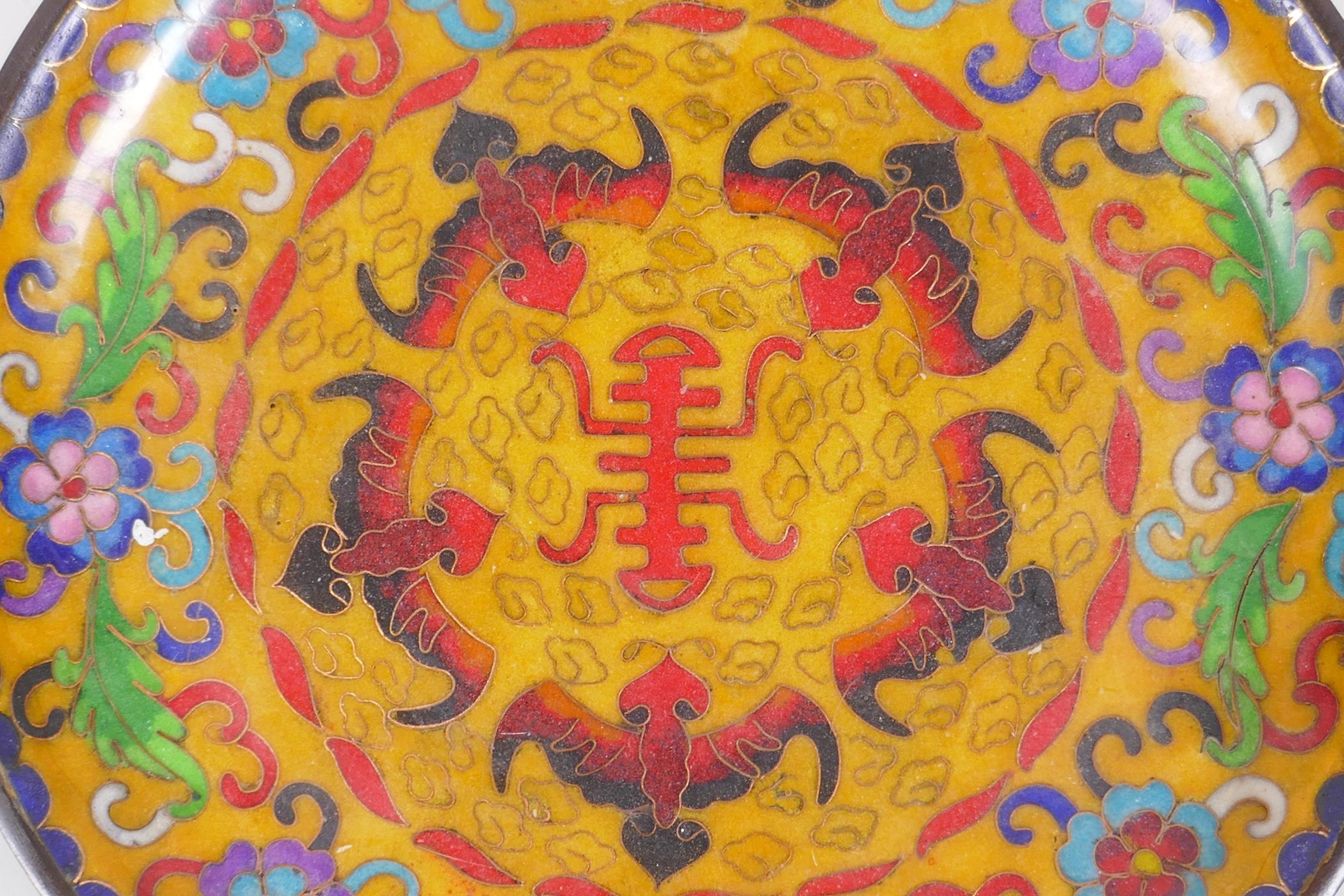 A Chinese cloisonne dish decorated with bats, flowers and auspicious symbols, 20cm diameter - Image 2 of 3