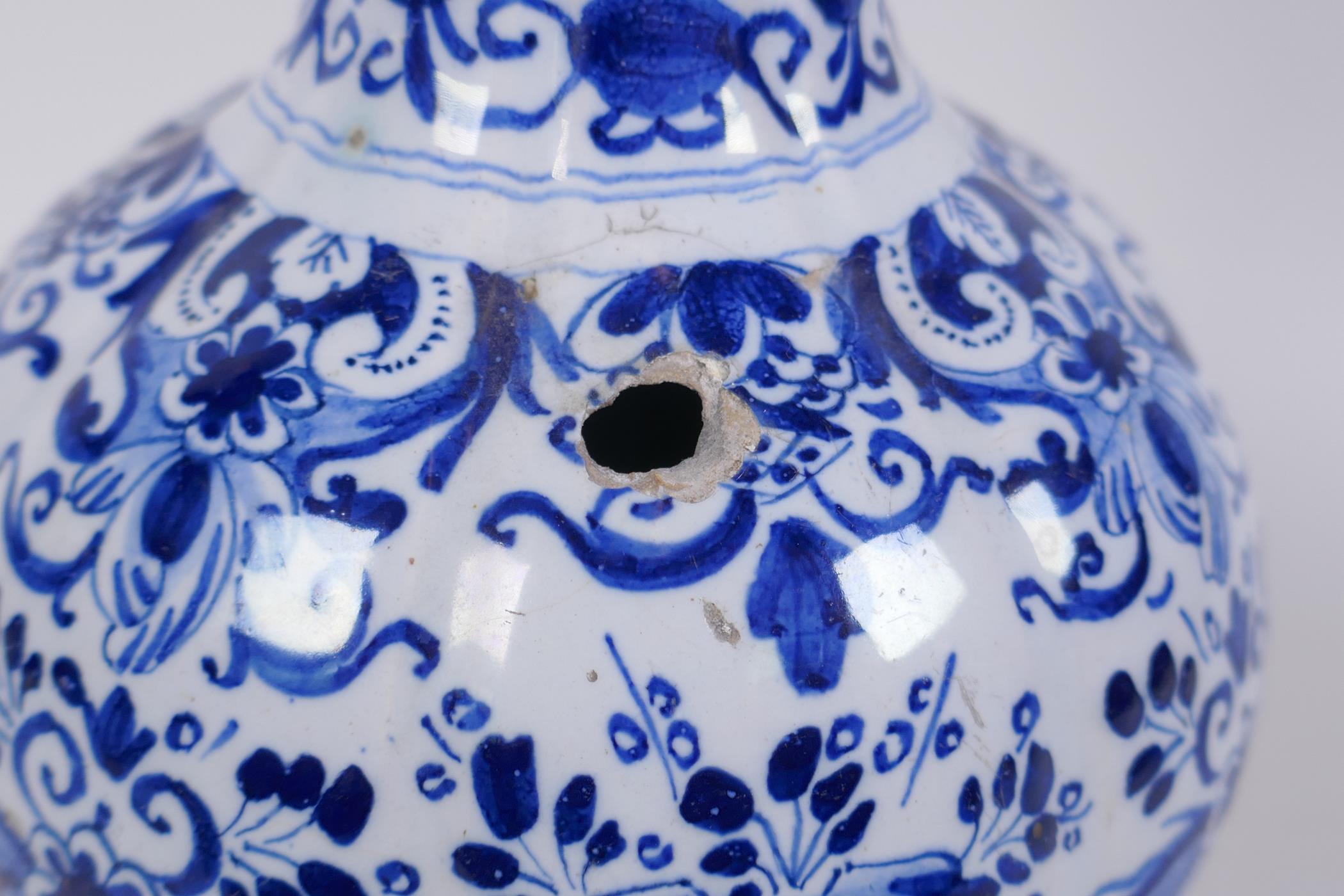An C18th/C19th Delft blue and white garlic head shaped vase, decorated with birds, flowers and - Image 6 of 7
