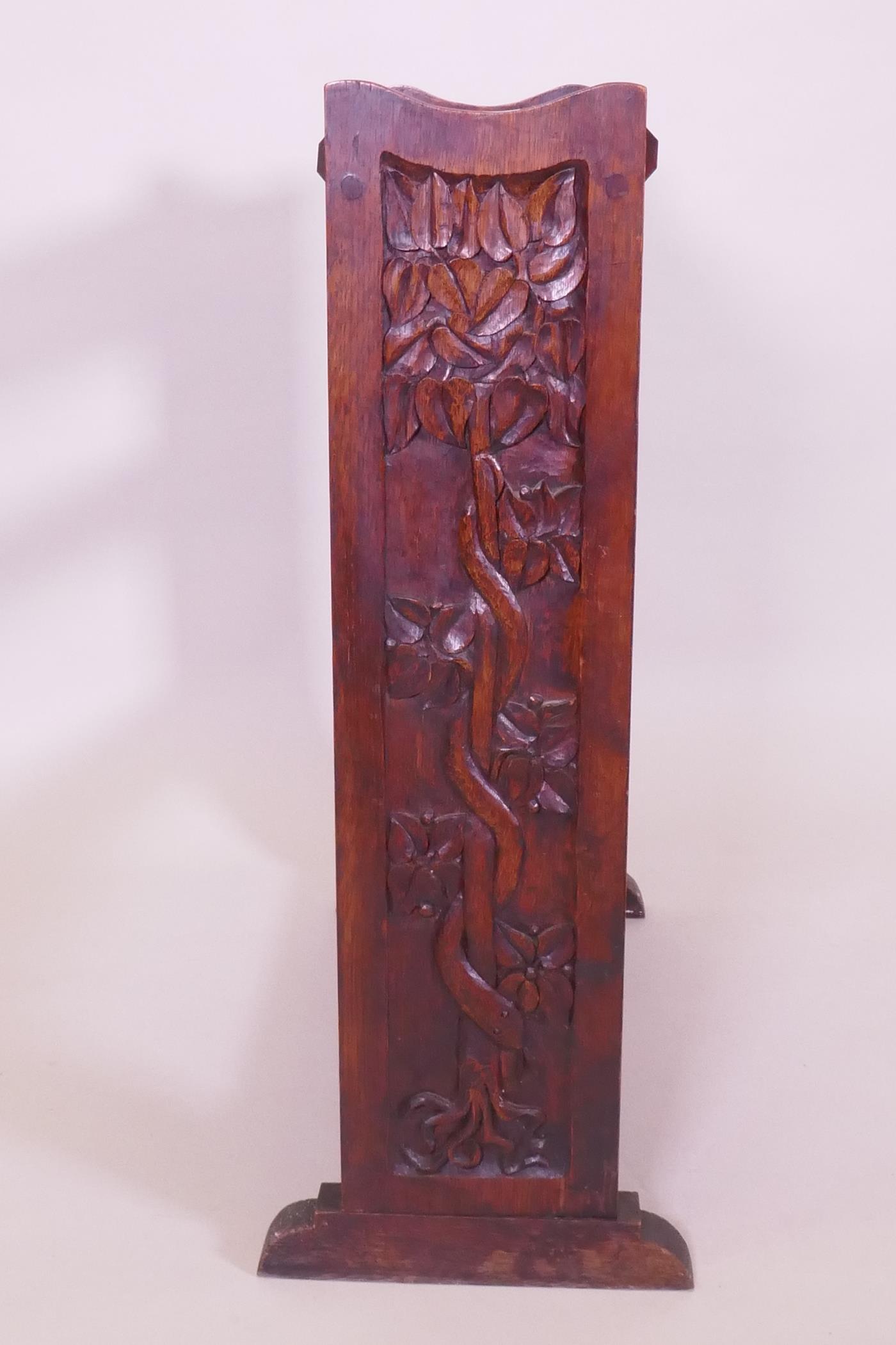An Arts & Crafts oak open bookshelf with trough top, the sides carved with a serpent coiled around a - Image 3 of 4